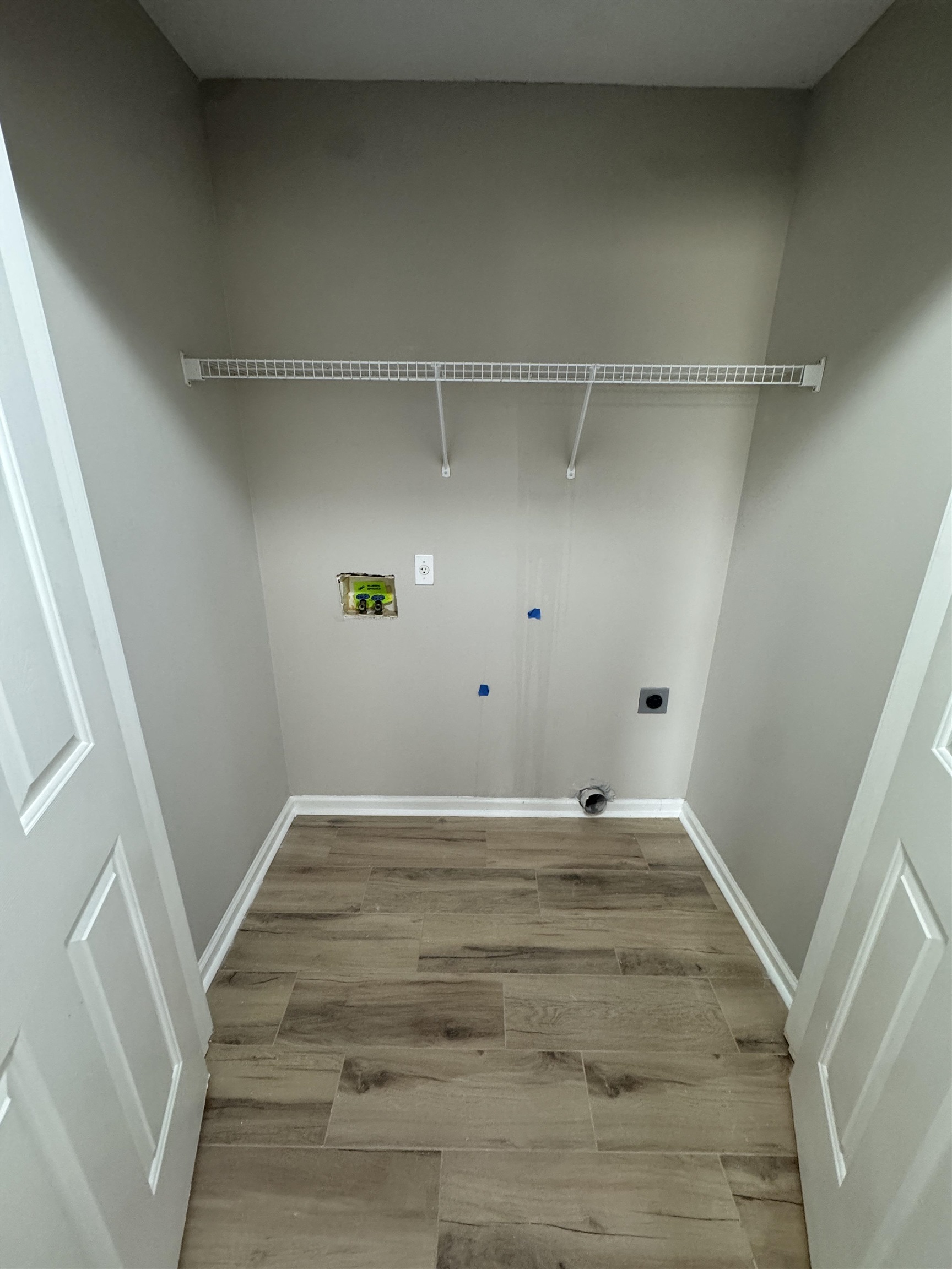5457 Sundale Way South Memphis, TN 38135 - Photo 15 of 23 Laundry room featuring light wood finished floors, washer hookup, and hookup for an electric dryer