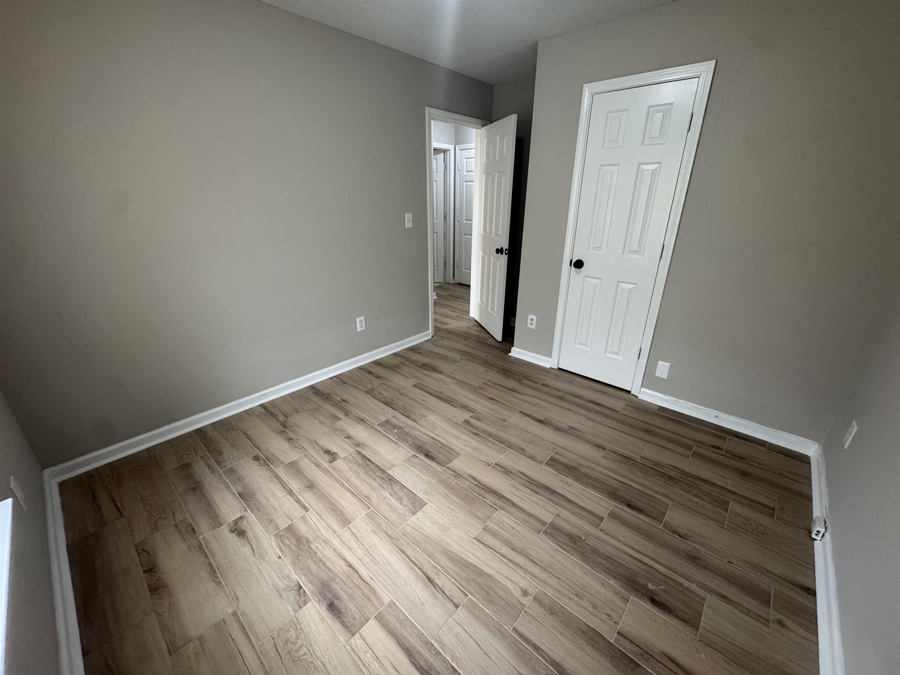 5457 Sundale Way South Memphis, TN 38135 - Photo 17 of 23 Unfurnished bedroom featuring light wood-style flooring and a closet