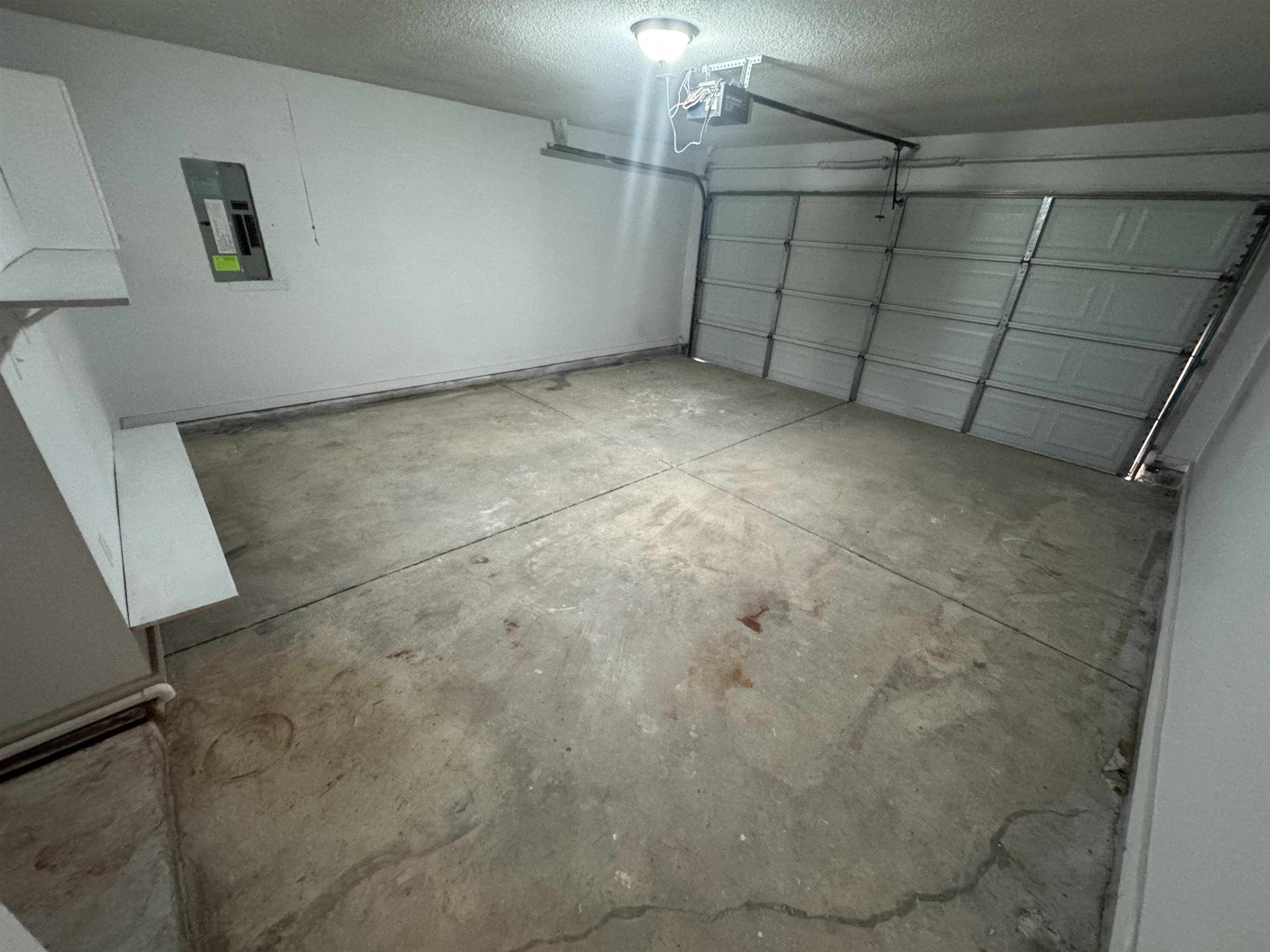 5457 Sundale Way South Memphis, TN 38135 - Photo 21 of 23 Garage featuring electric panel and a garage door opener