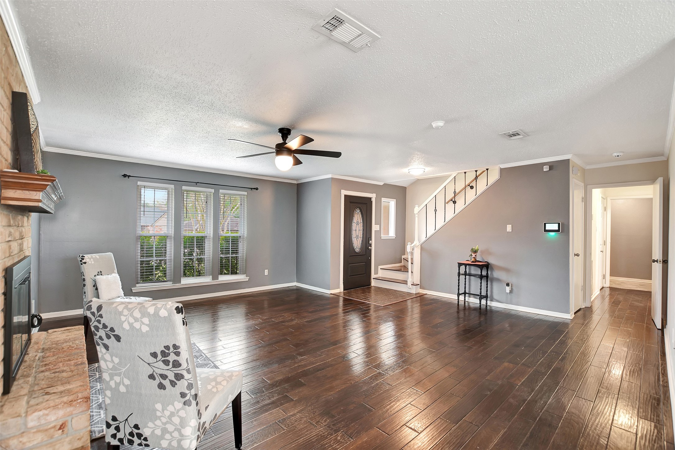 8 Arlington Street Conroe, TX 77301 - Photo 11 of 43 a view of an empty room with wooden floor and a window