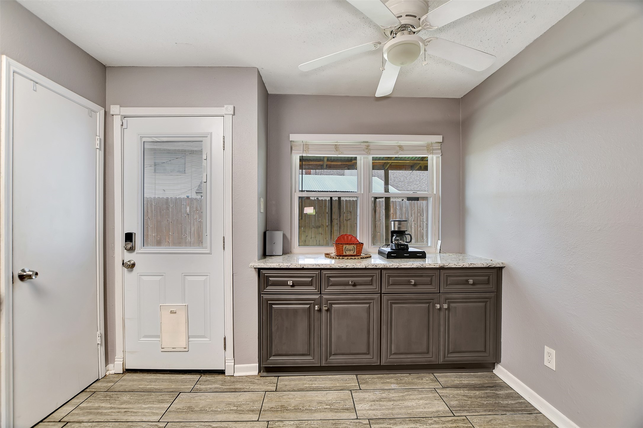 8 Arlington Street Conroe, TX 77301 - Photo 22 of 43 a kitchen with a sink and a refrigerator
