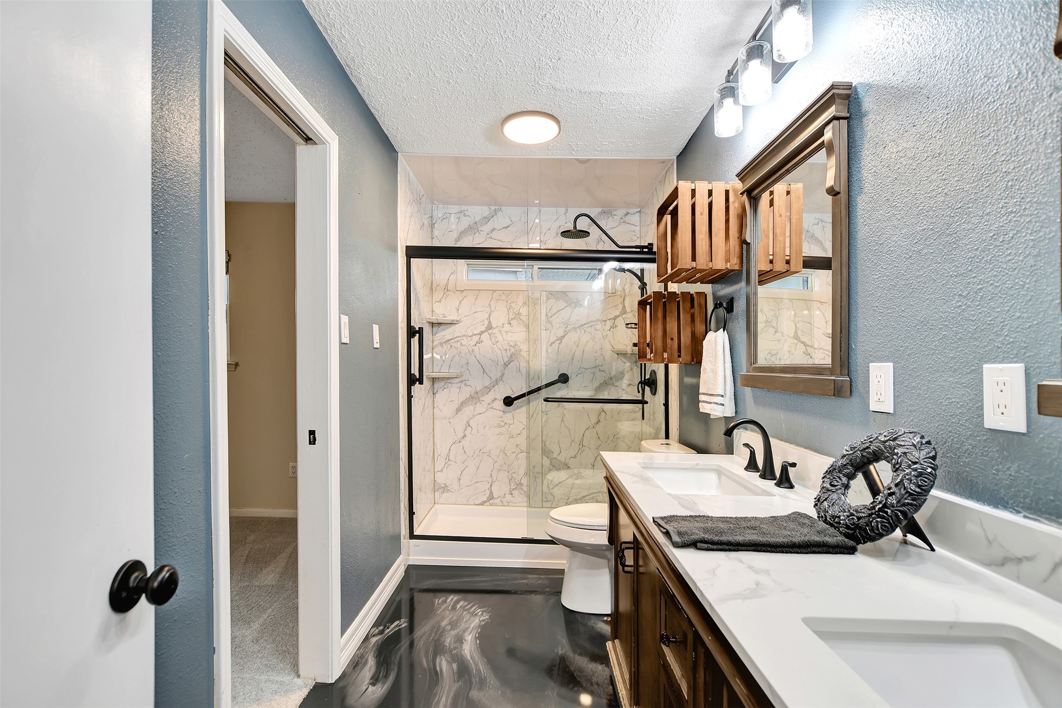 8 Arlington Street Conroe, TX 77301 - Photo 27 of 43 a kitchen with a sink stove and shower