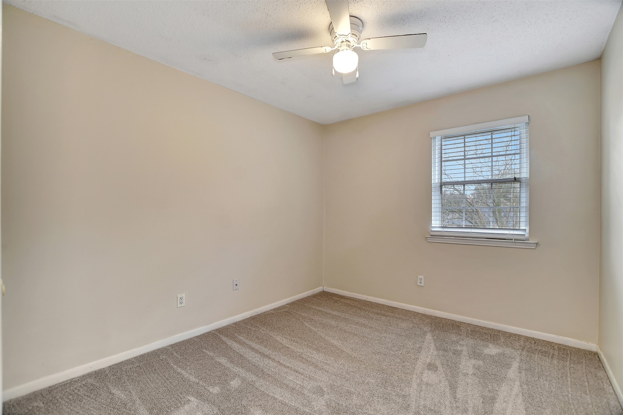 8 Arlington Street Conroe, TX 77301 - Photo 31 of 43 wooden floor in an empty room with a window