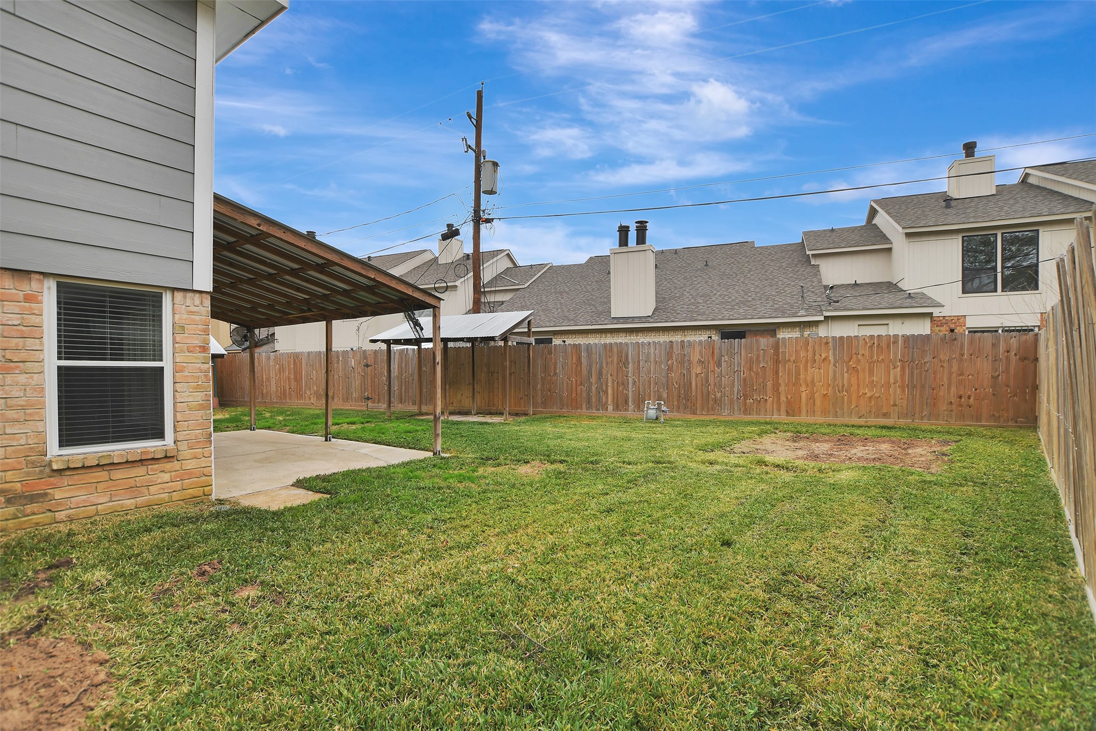 8 Arlington Street Conroe, TX 77301 - Photo 36 of 43 a view of a backyard with a garden