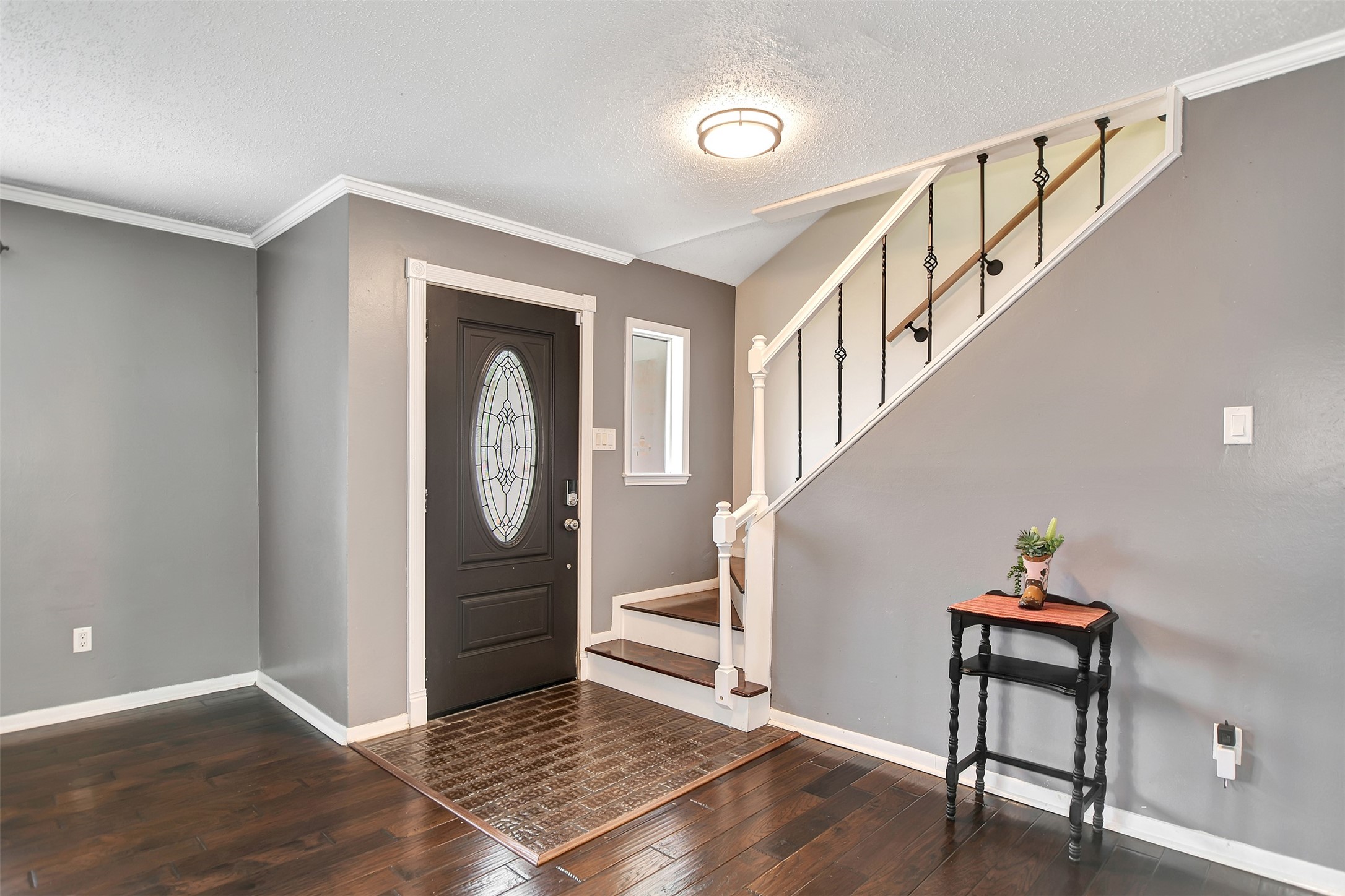 8 Arlington Street Conroe, TX 77301 - Photo 7 of 43 a view of an entryway with wooden floor