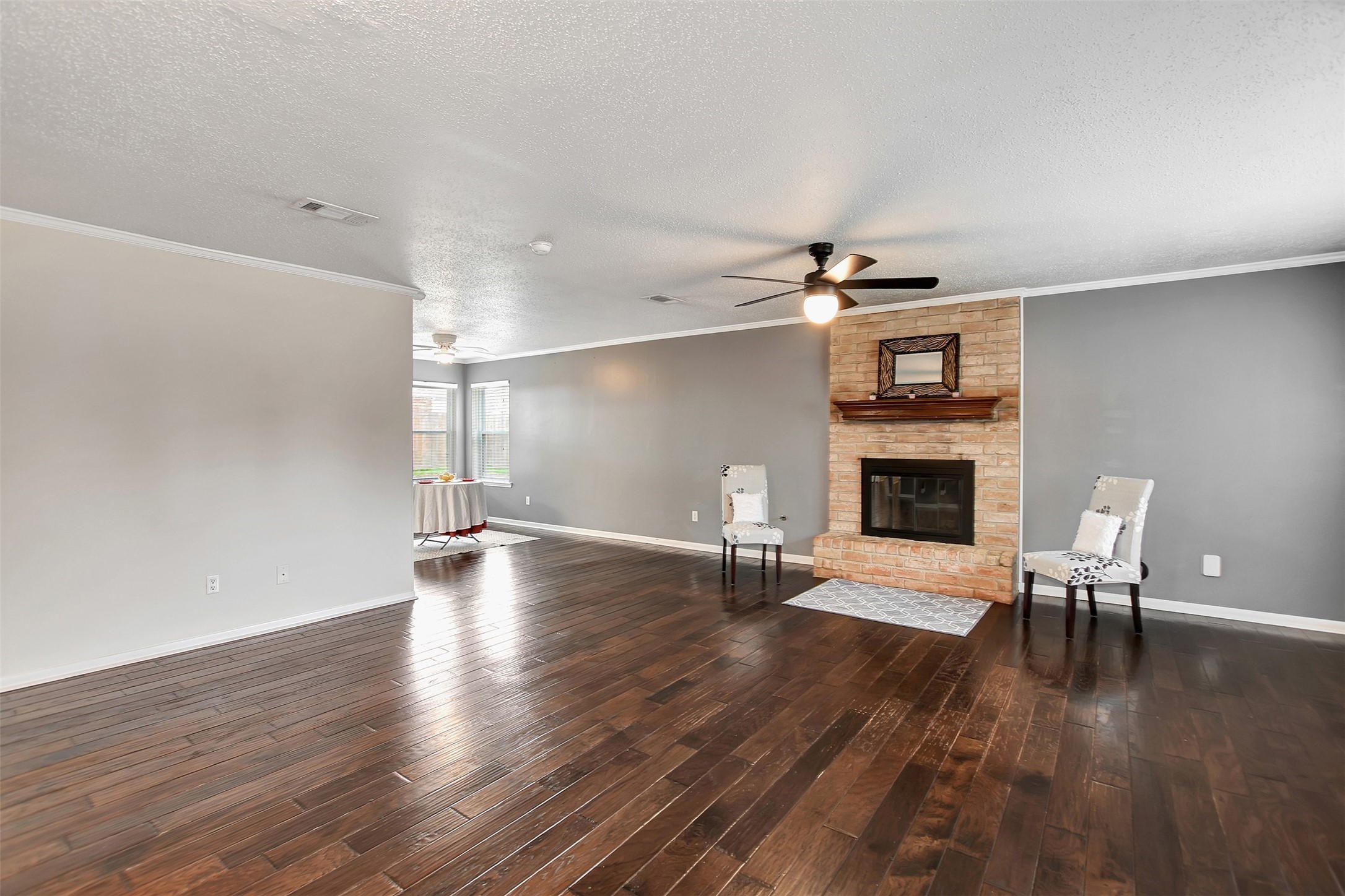 8 Arlington Street Conroe, TX 77301 - Photo 8 of 43 a living room with furniture and a fireplace