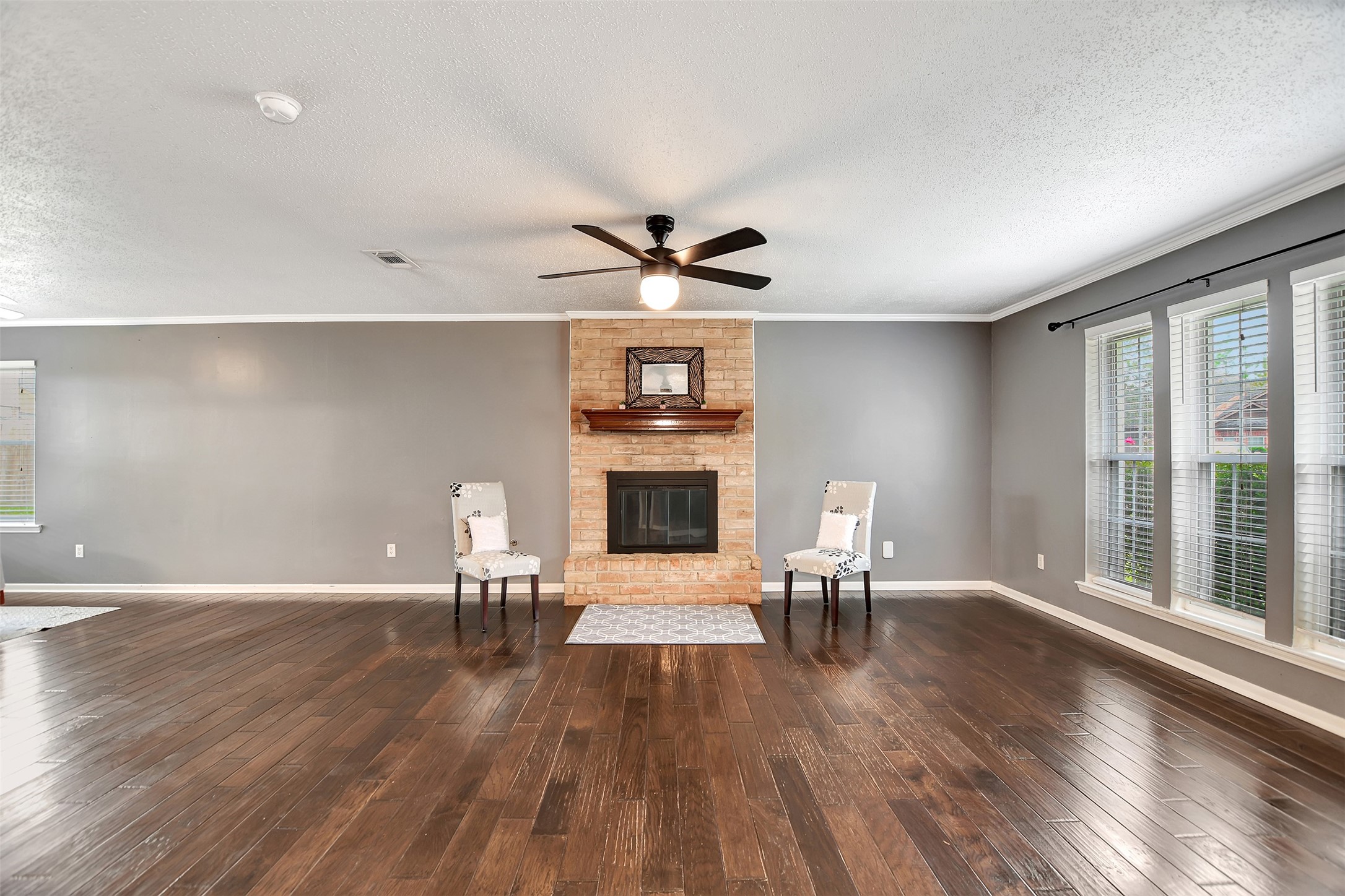 8 Arlington Street Conroe, TX 77301 - Photo 9 of 43 a living room with furniture and a fireplace