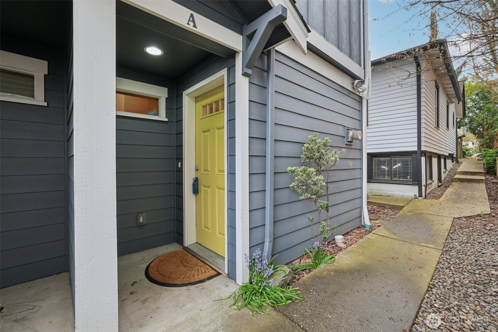 9047 17th Avenue Southwest, Unit A Seattle, WA 98106 - Photo 1 of 29 a view of porch with a table and chair