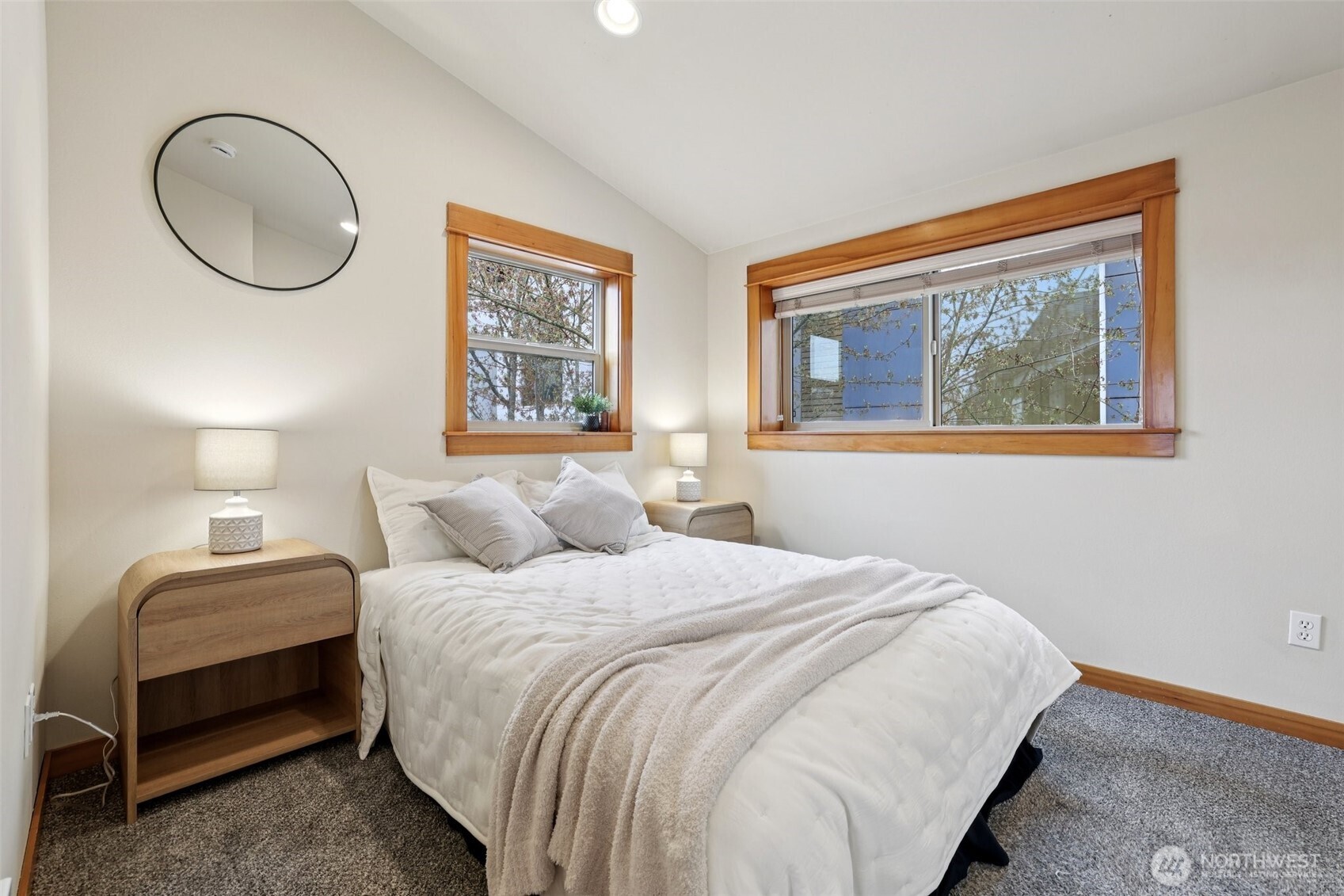 9047 17th Avenue Southwest, Unit A Seattle, WA 98106 - Photo 19 of 29 a bedroom with bed and a window