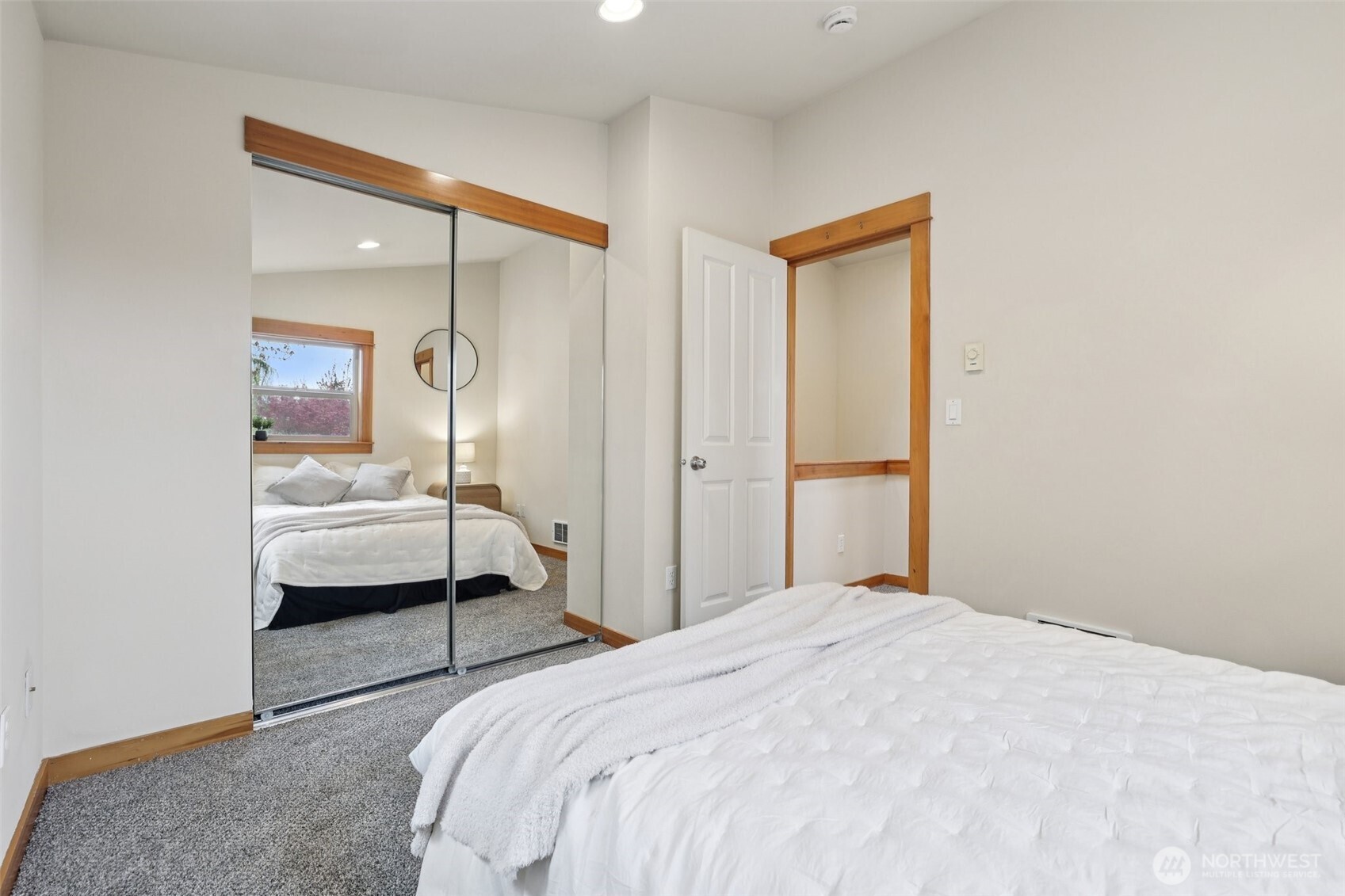 9047 17th Avenue Southwest, Unit A Seattle, WA 98106 - Photo 21 of 29 a bedroom with a bed and a window