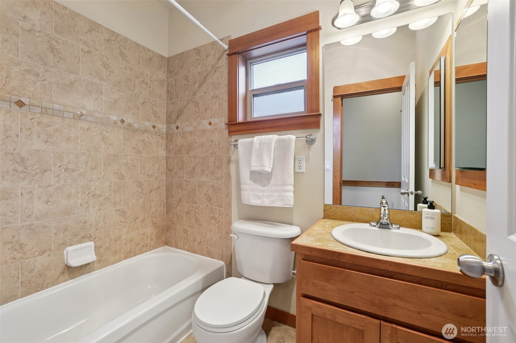 9047 17th Avenue Southwest, Unit A Seattle, WA 98106 - Photo 22 of 29 a bathroom with a sink a toilet and shower
