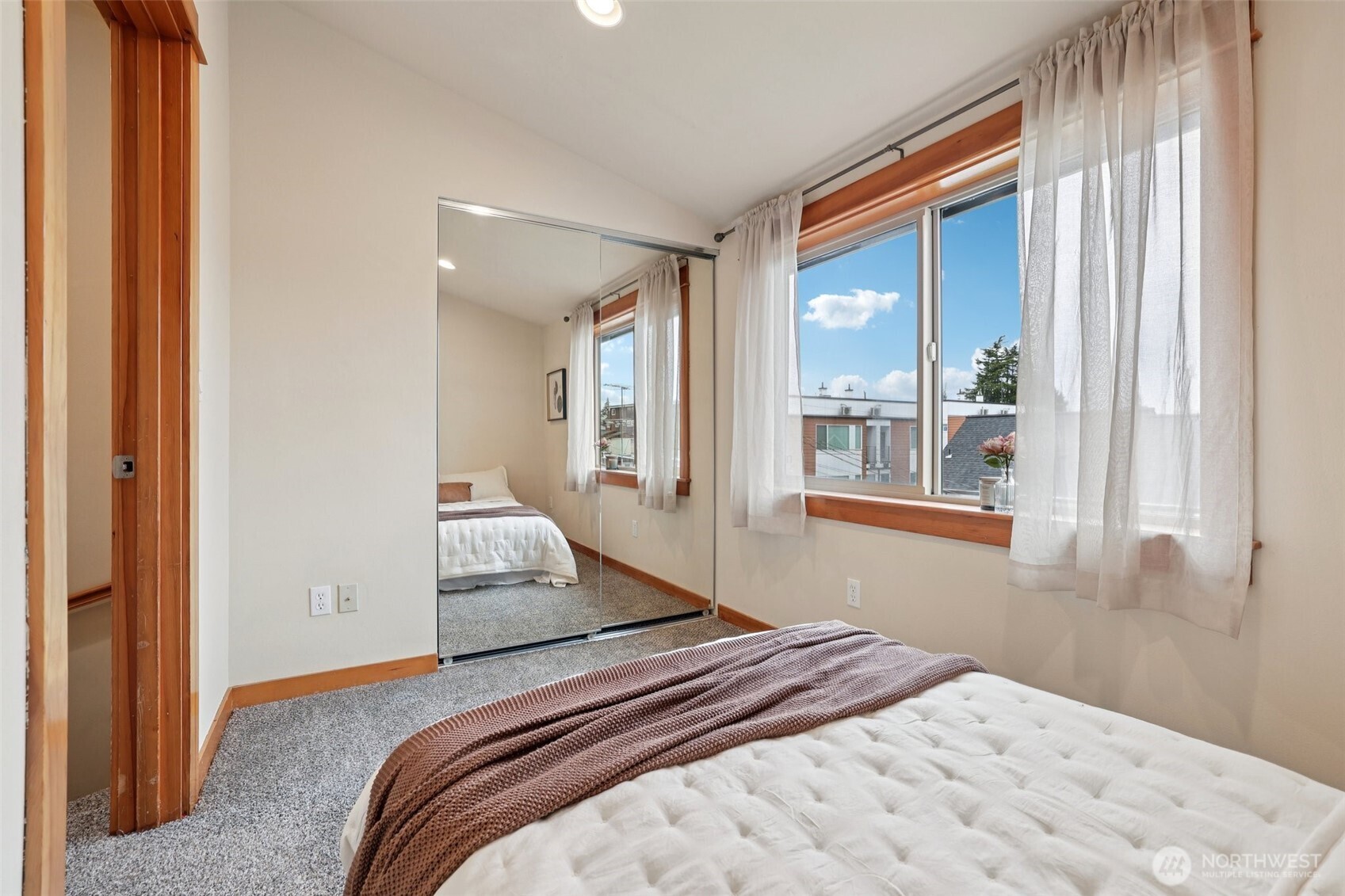 9047 17th Avenue Southwest, Unit A Seattle, WA 98106 - Photo 26 of 29 a bedroom with a large bed and a window