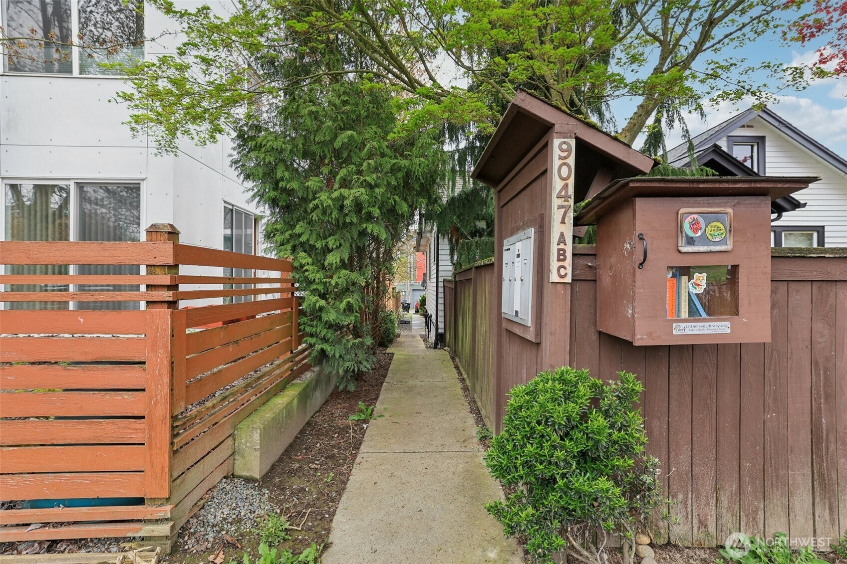 9047 17th Avenue Southwest, Unit A Seattle, WA 98106 - Photo 5 of 29 a view of a house with a yard