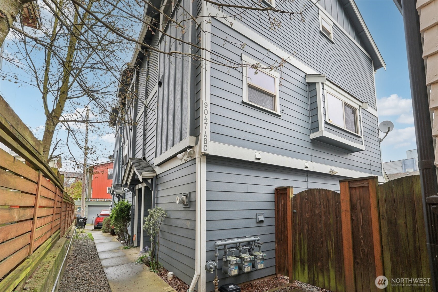 9047 17th Avenue Southwest, Unit A Seattle, WA 98106 - Photo 6 of 29 a view of a house with wooden fence