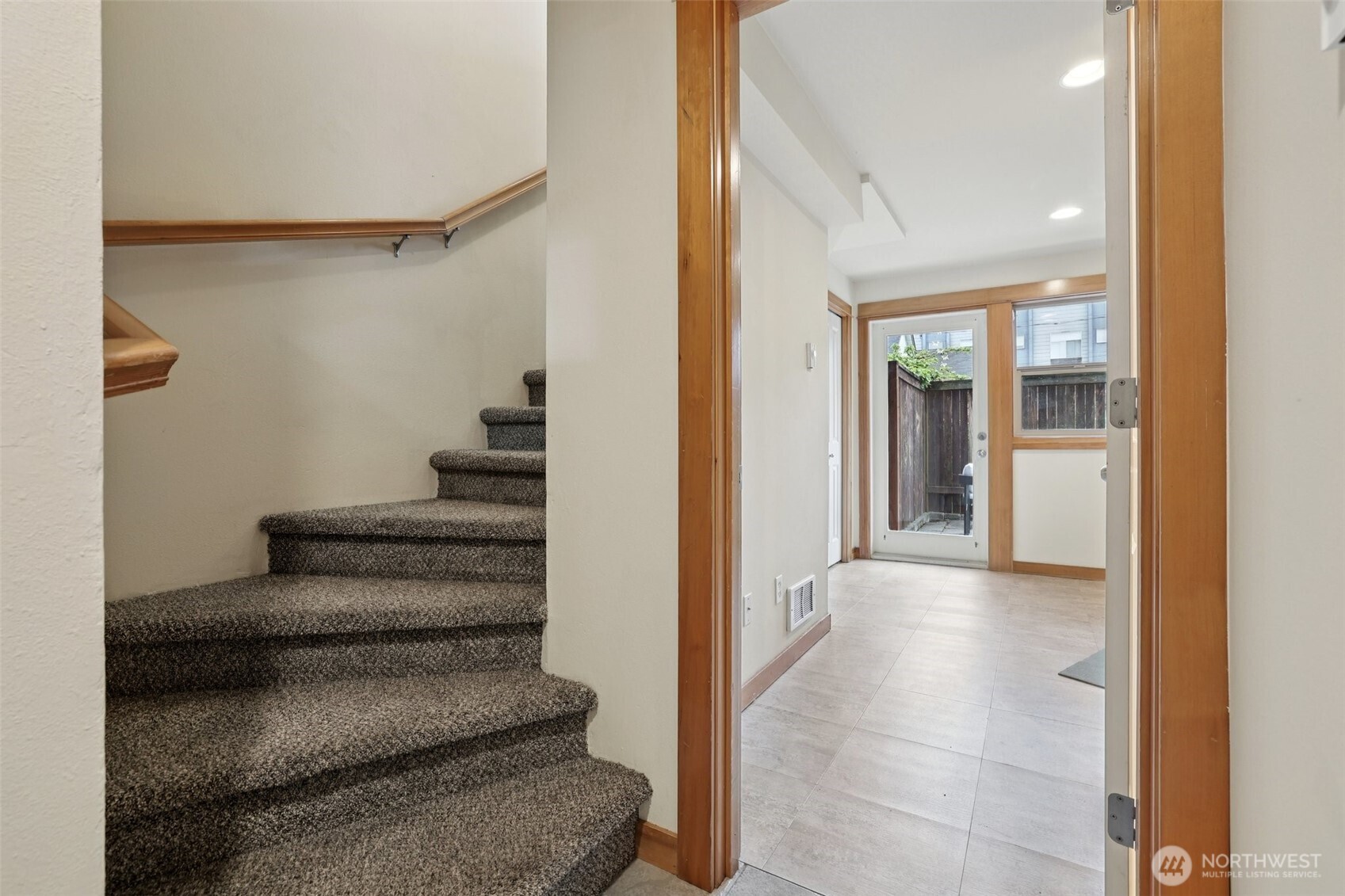 9047 17th Avenue Southwest, Unit A Seattle, WA 98106 - Photo 7 of 29 a view of a hallway with wooden floor and entryway