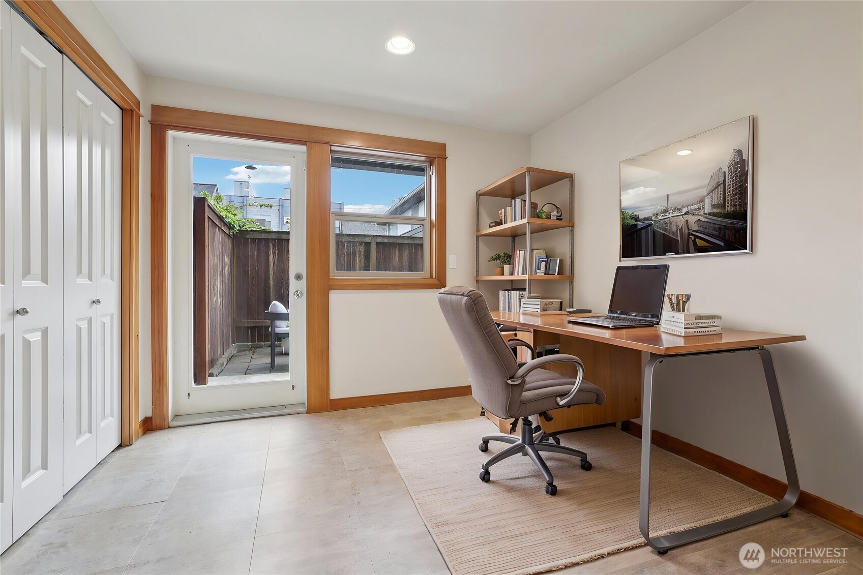 9047 17th Avenue Southwest, Unit A Seattle, WA 98106 - Photo 9 of 29 a workspace with wooden floor and a window