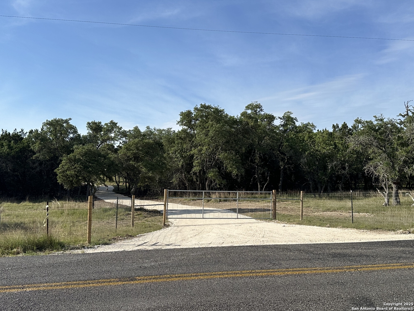 10205 Johns Road, Unit 2 Boerne, TX 78006 - Photo 2 of 11 a view of a tennis court