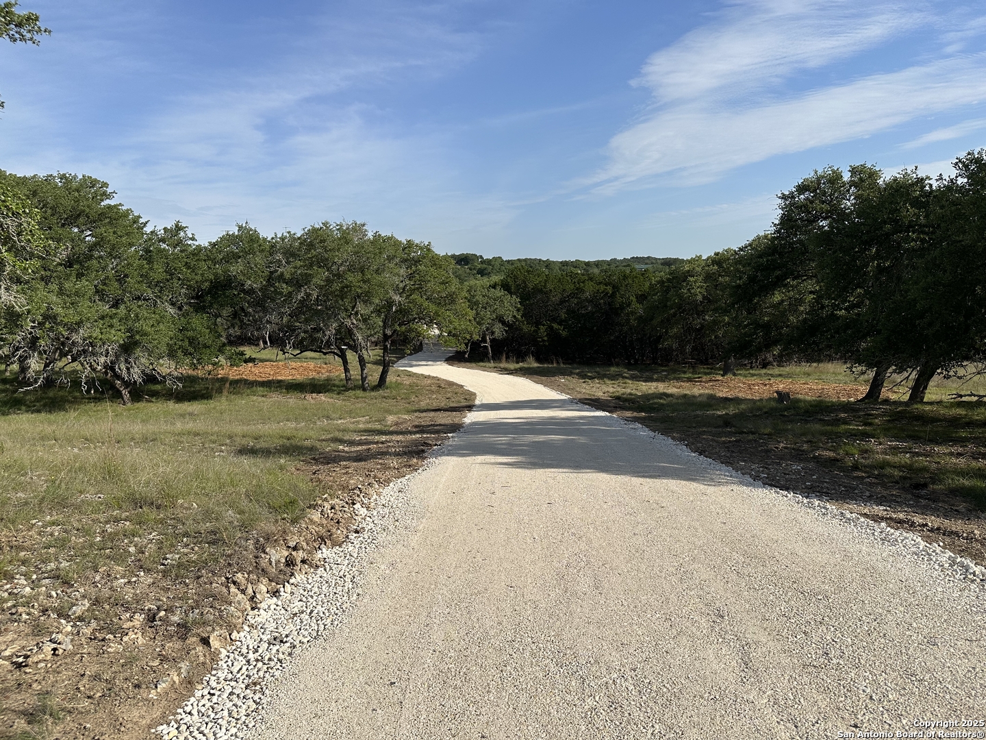 10205 Johns Road, Unit 2 Boerne, TX 78006 - Photo 8 of 11 a view of road with yard