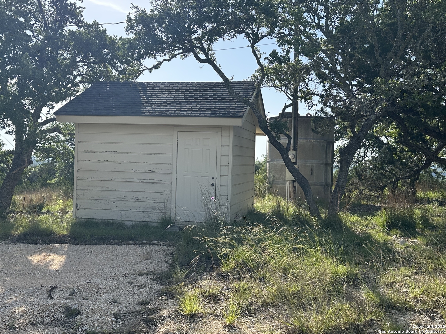 10205 Johns Road, Unit 2 Boerne, TX 78006 - Photo 10 of 11 a front view of a house with a yard