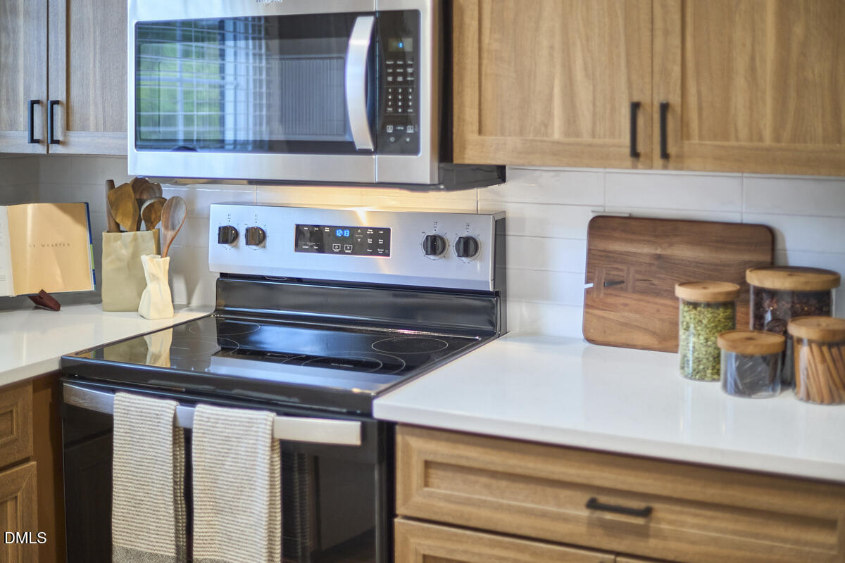 2613 McNeil Street, Unit B Raleigh, NC 27608 - Photo 18 of 31 a kitchen with a stove and a sink