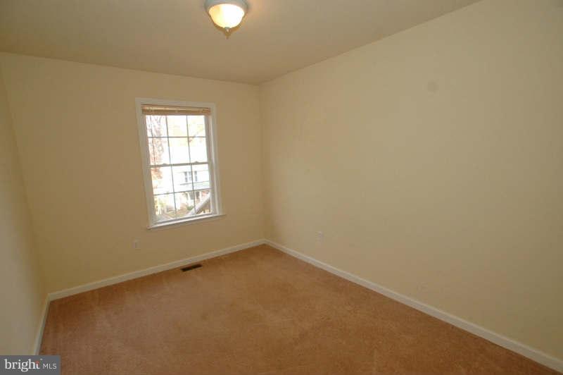 3641 Clifmar Road Baltimore, MD 21244 - Photo 11 of 27 an empty room with a window