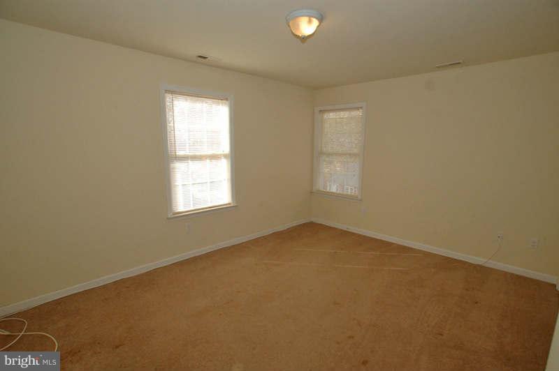 3641 Clifmar Road Baltimore, MD 21244 - Photo 17 of 27 an empty room with windows