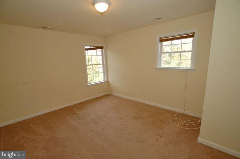 3641 Clifmar Road Baltimore, MD 21244 - Photo 20 of 27 an empty room with windows