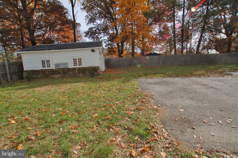 3641 Clifmar Road Baltimore, MD 21244 - Photo 27 of 27 a view of a yard with a house and a large tree