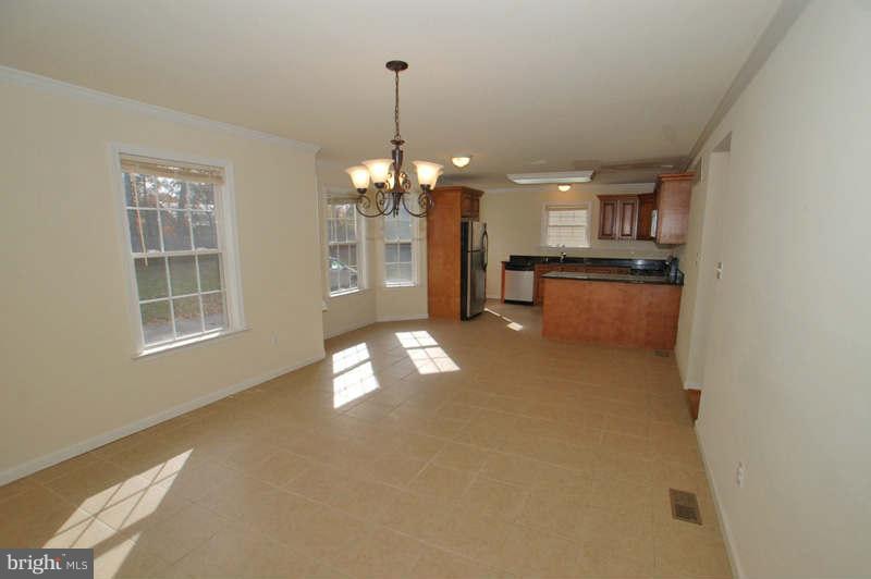 3641 Clifmar Road Baltimore, MD 21244 - Photo 6 of 27 a view of a room with windows and chandelier