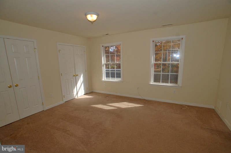 3641 Clifmar Road Baltimore, MD 21244 - Photo 9 of 27 a view of an empty room with a window