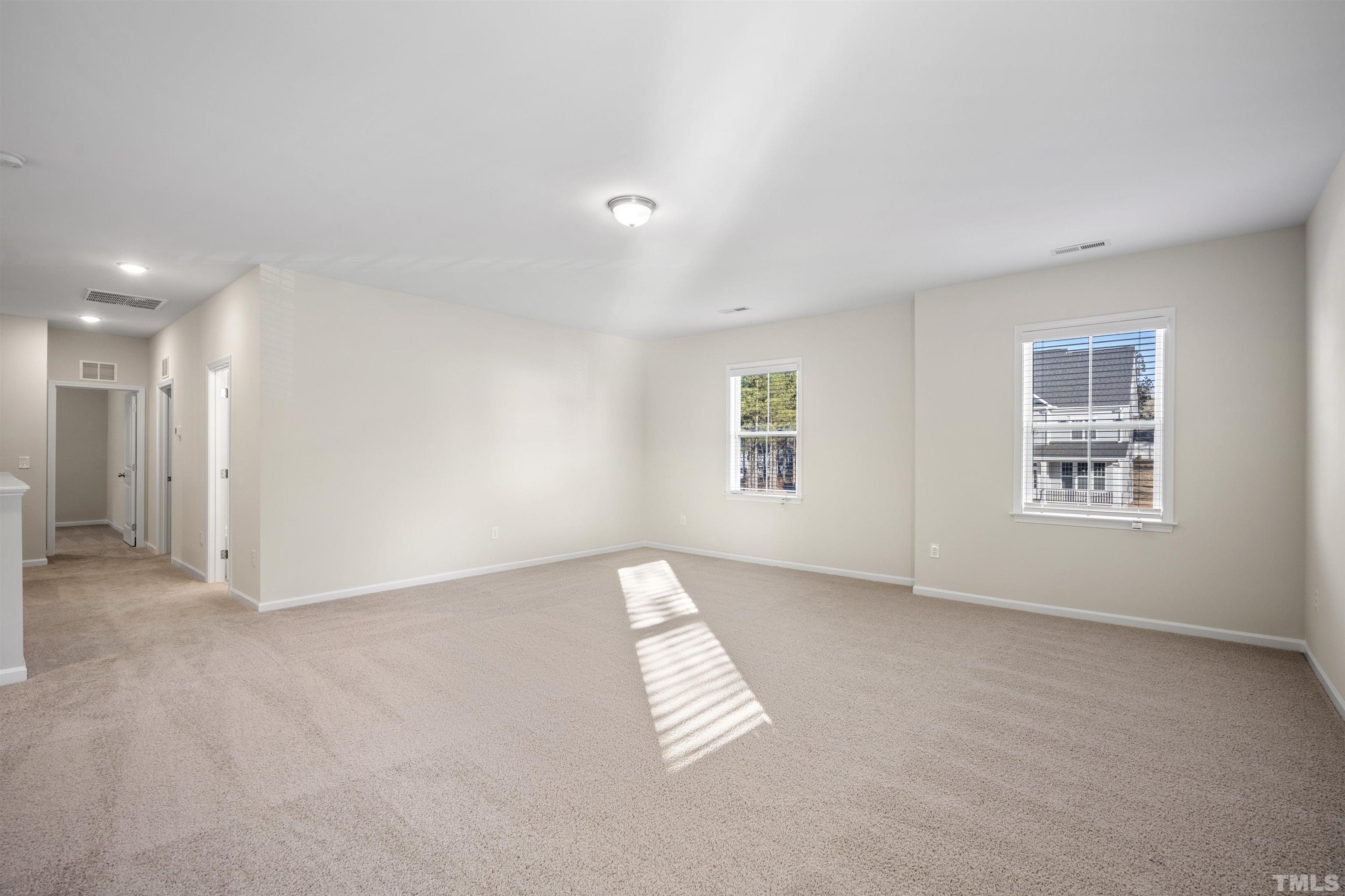 177 Karlov Road Garner, NC 27529 - Photo 14 of 39 an empty room with windows