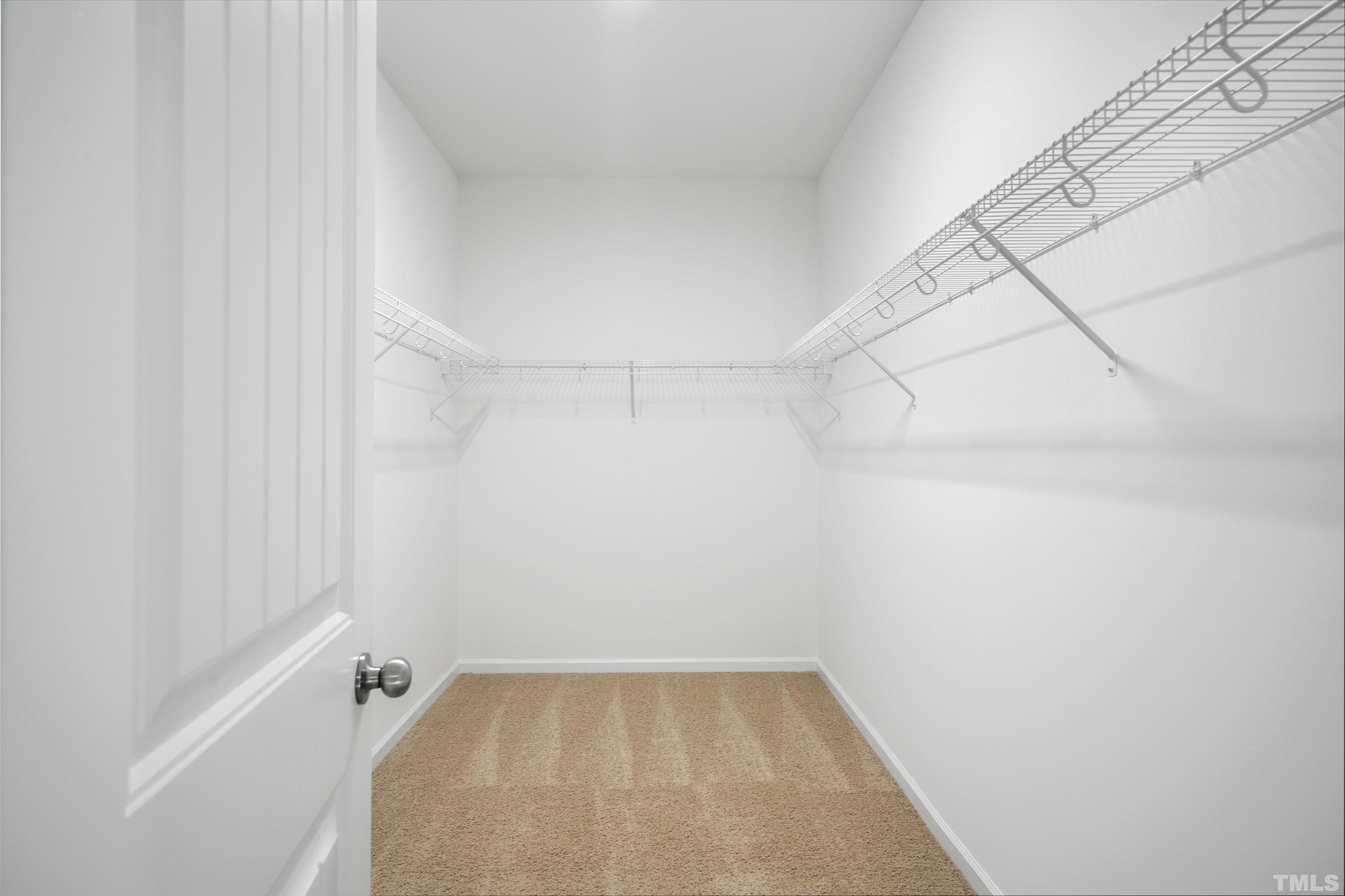 177 Karlov Road Garner, NC 27529 - Photo 15 of 39 a view of a room with racks on the wall