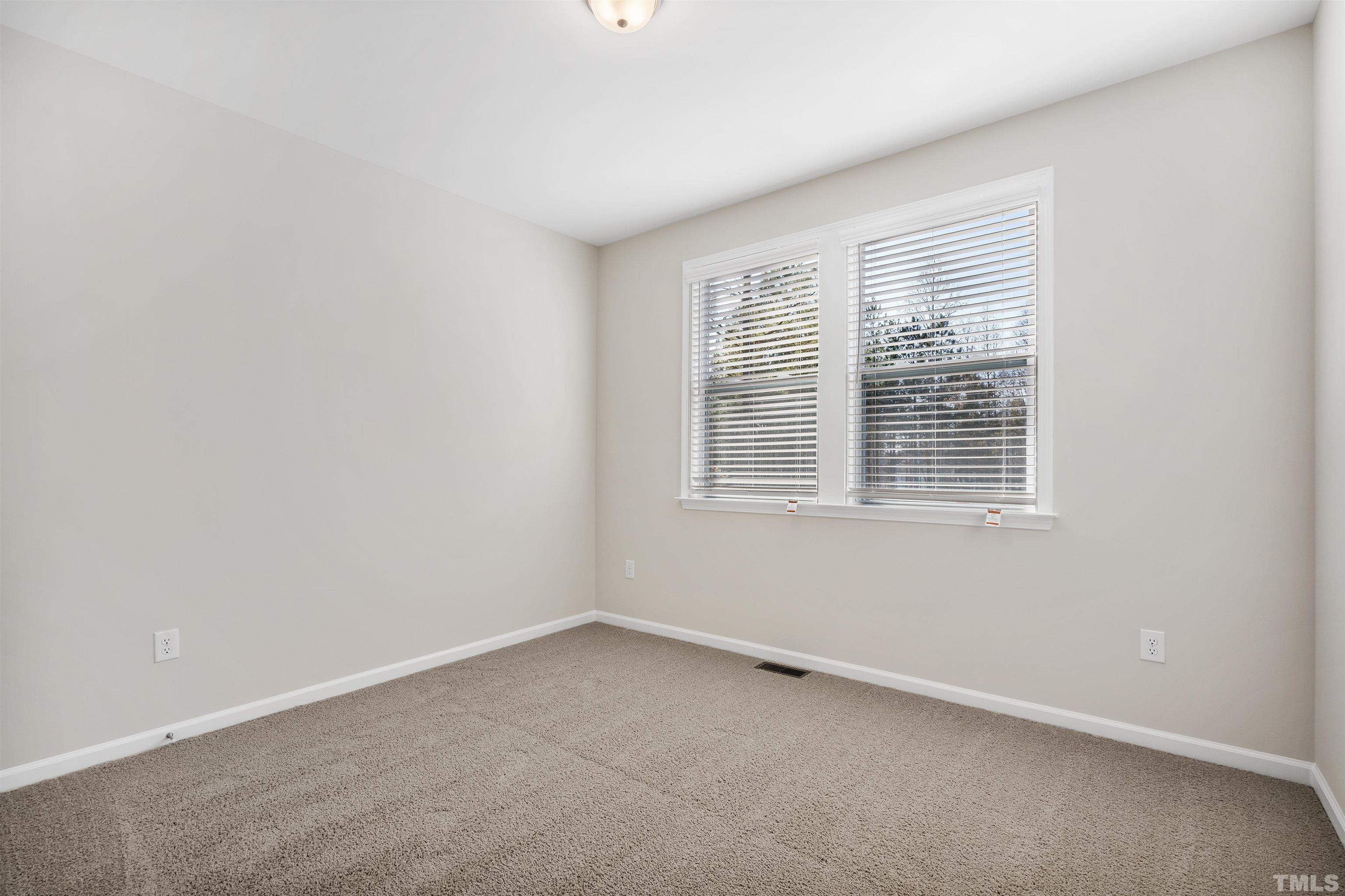 177 Karlov Road Garner, NC 27529 - Photo 16 of 39 an empty room with a window