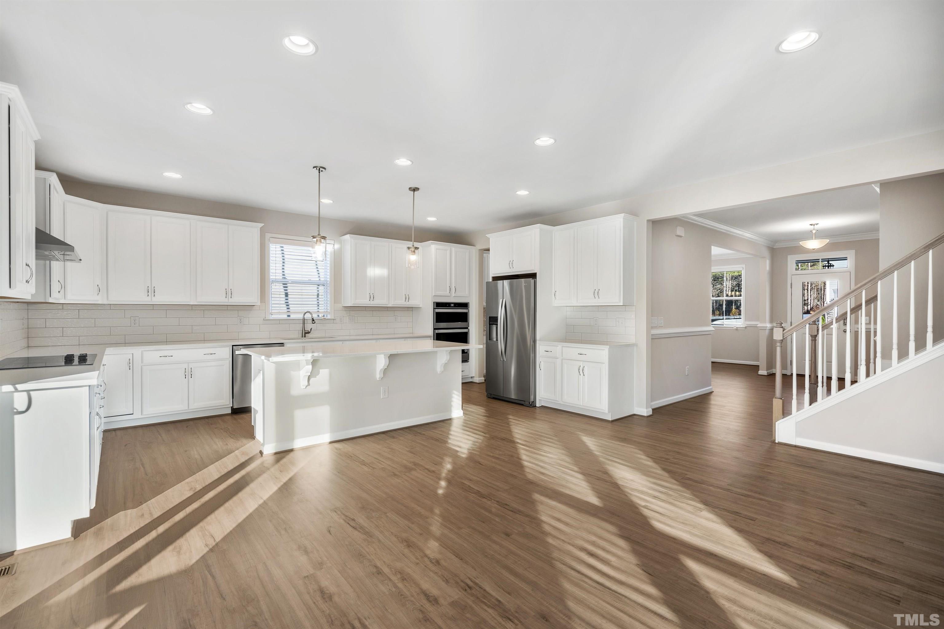 177 Karlov Road Garner, NC 27529 - Photo 2 of 39 a large kitchen with a white stove top oven and cabinets