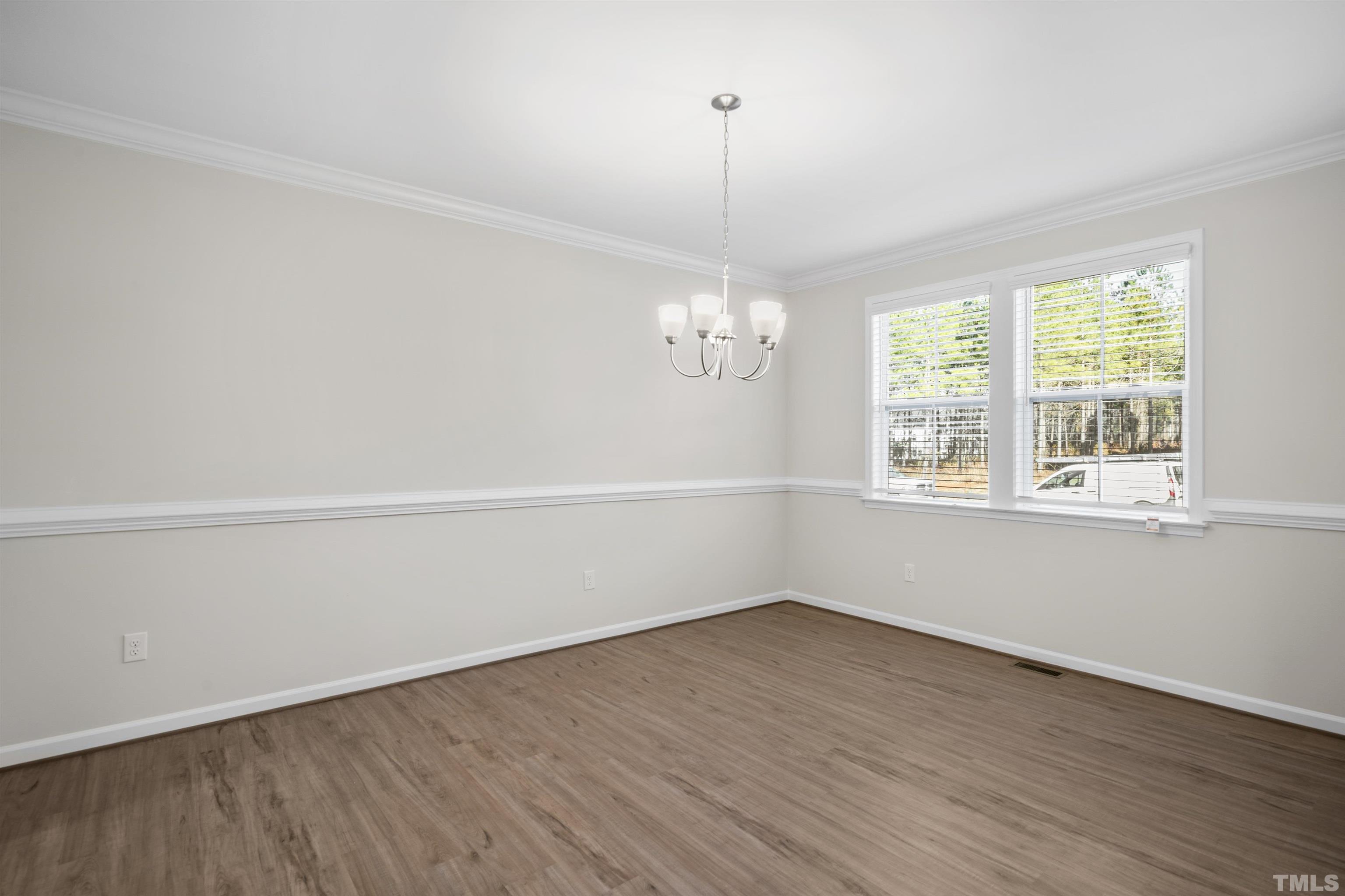 177 Karlov Road Garner, NC 27529 - Photo 25 of 39 a view of a room with wooden floor and window