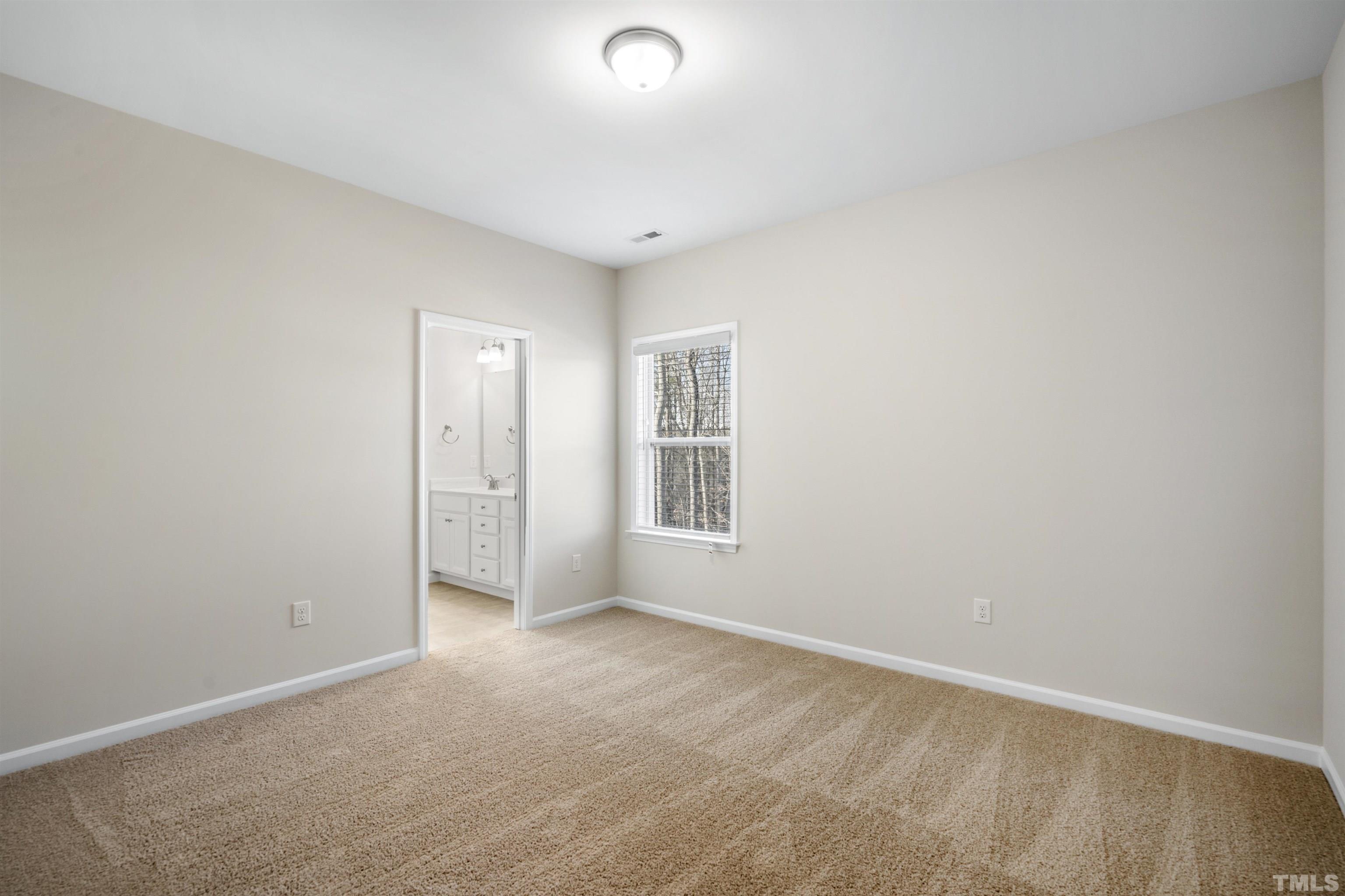 177 Karlov Road Garner, NC 27529 - Photo 26 of 39 a view of an empty room with a window