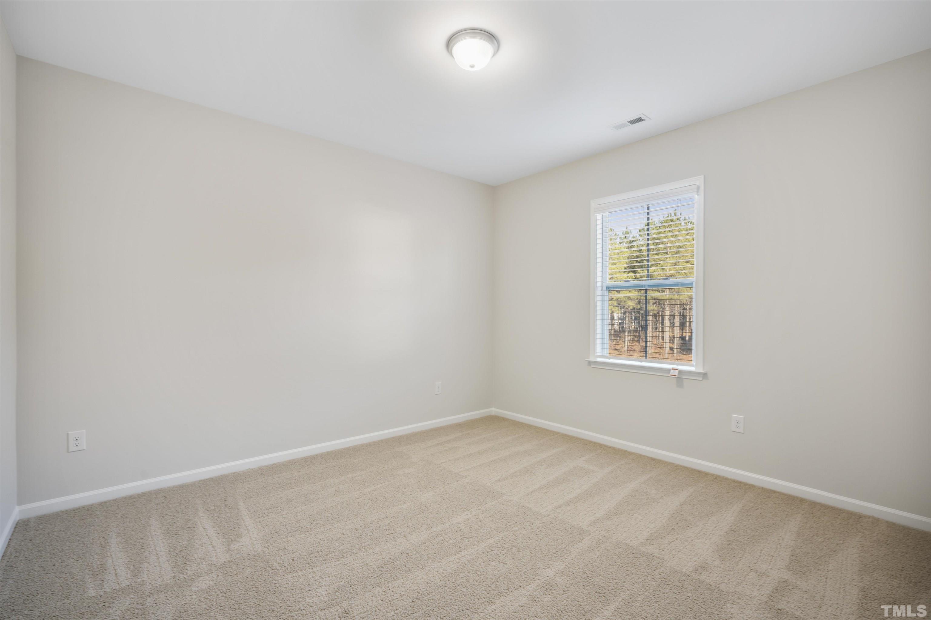 177 Karlov Road Garner, NC 27529 - Photo 27 of 39 an empty room with a window