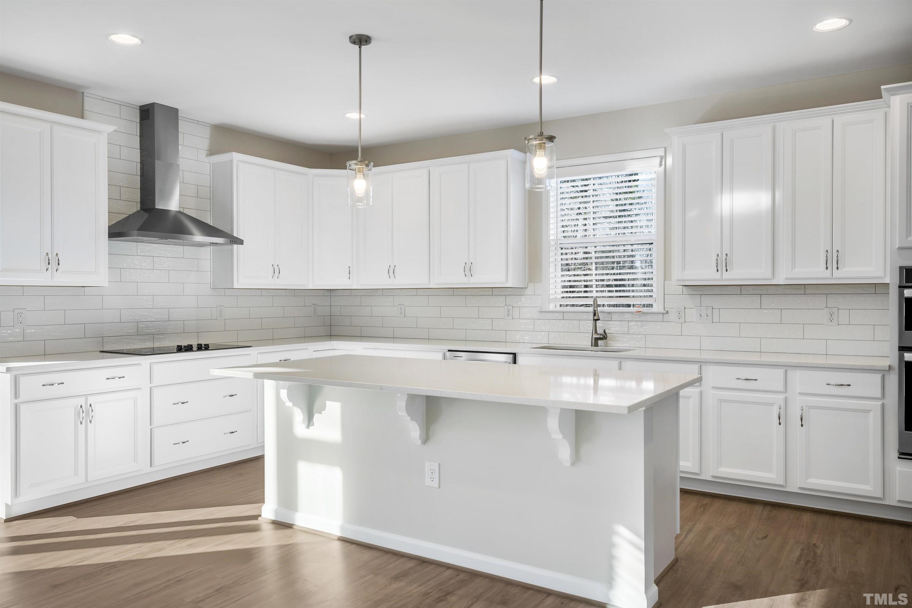 177 Karlov Road Garner, NC 27529 - Photo 39 of 39 a kitchen with stainless steel appliances granite countertop a sink a stove and white cabinets