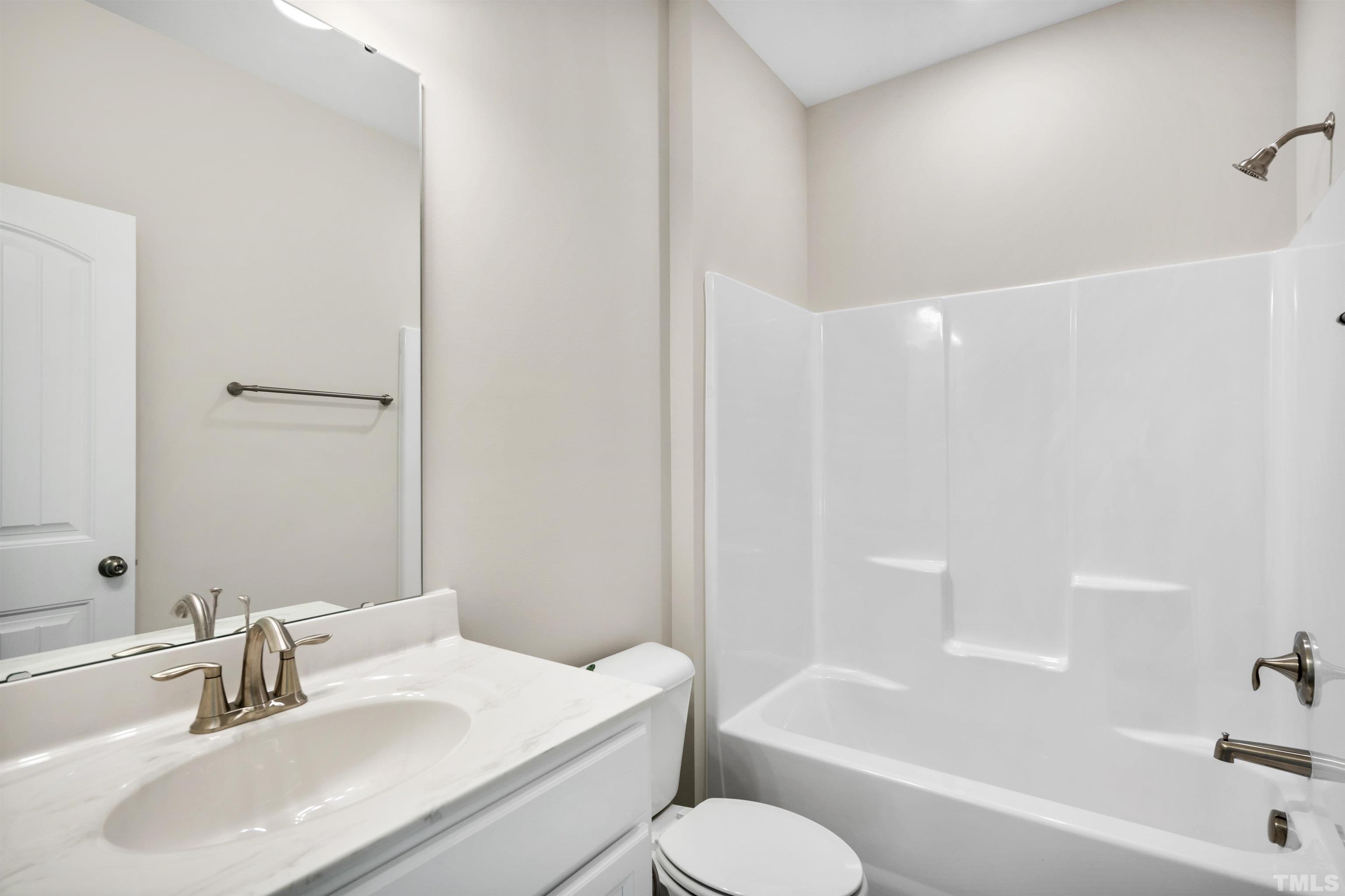 177 Karlov Road Garner, NC 27529 - Photo 10 of 39 a bathroom with a sink toilet and bathtub