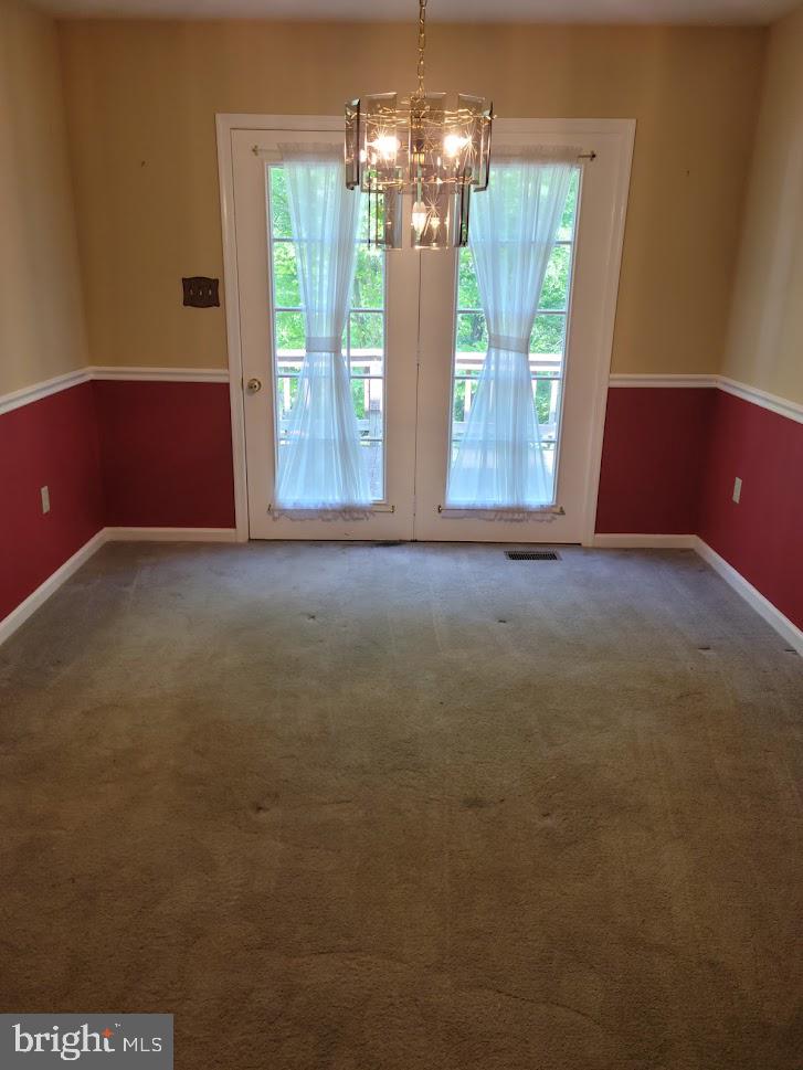 309 Windy Pines Road Front Royal, VA 22630 - Photo 8 of 48 Dining room with chair rail, French doors to deck