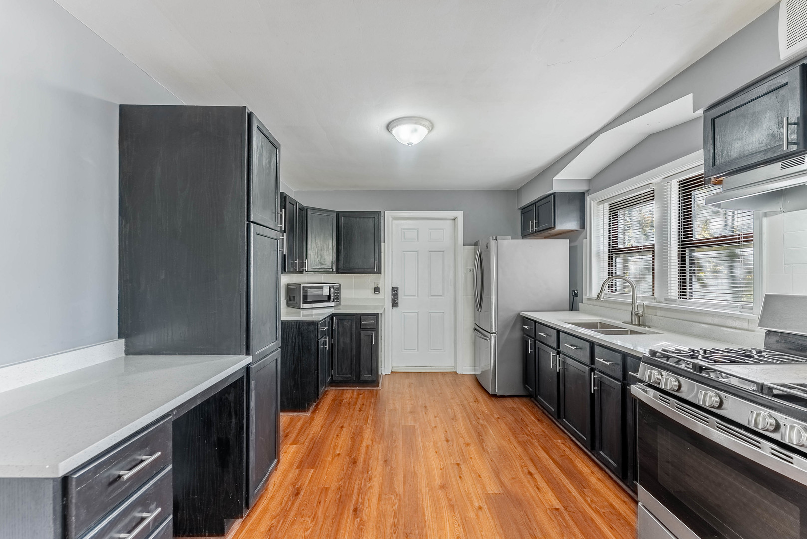 2345 Ridgeland Avenue, Unit 2 Berwyn, IL 60402 - Photo 5 of 18 a kitchen with a stove and a refrigerator