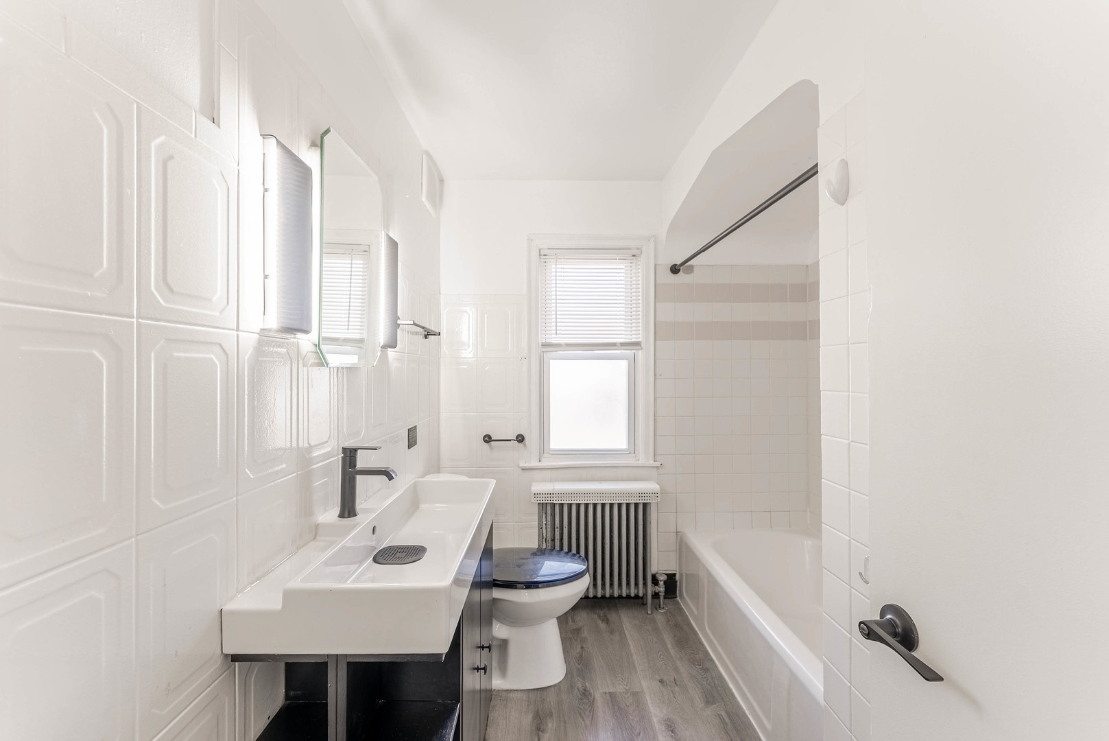 2345 Ridgeland Avenue, Unit 2 Berwyn, IL 60402 - Photo 9 of 18 a bathroom with a sink toilet and tub