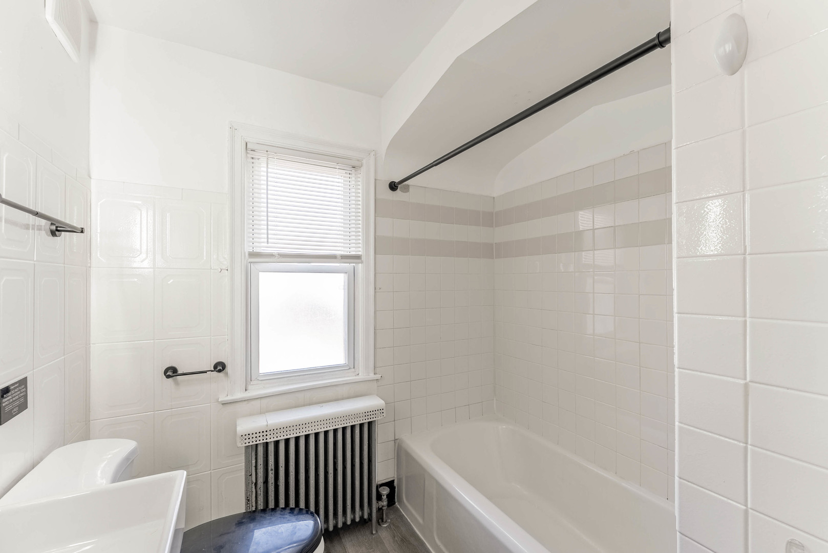 2345 Ridgeland Avenue, Unit 2 Berwyn, IL 60402 - Photo 10 of 18 a bathroom with a bathtub toilet and window