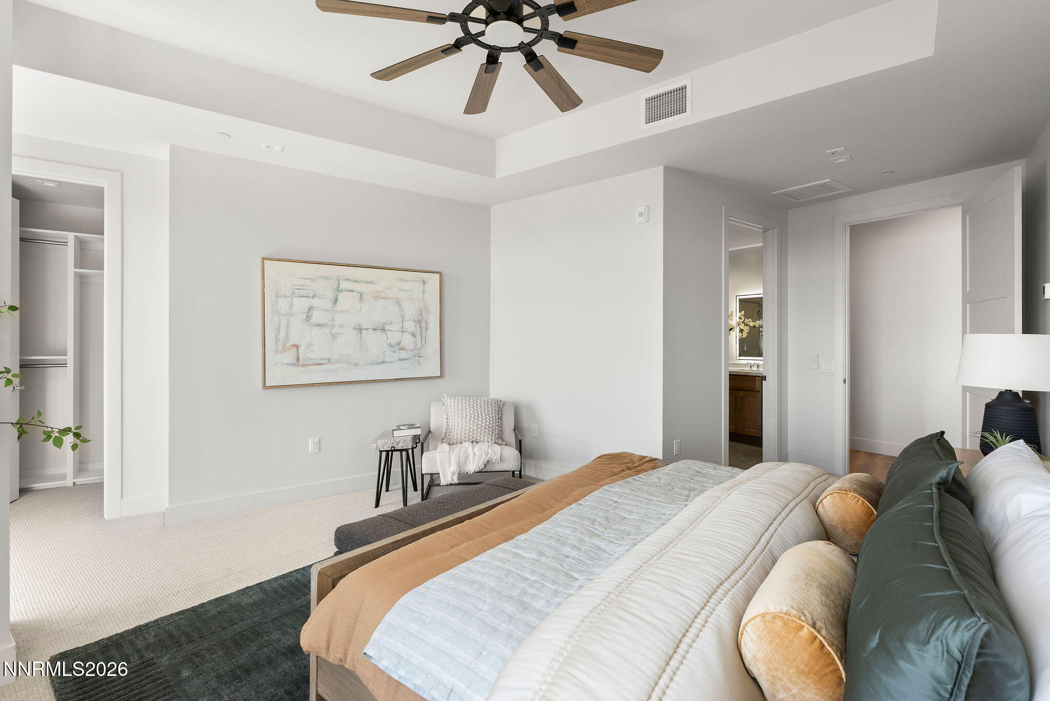 323 Tramway Drive, Unit 107 Stateline, NV 89449 - Photo 12 of 27 a bedroom with a bed and a chandelier