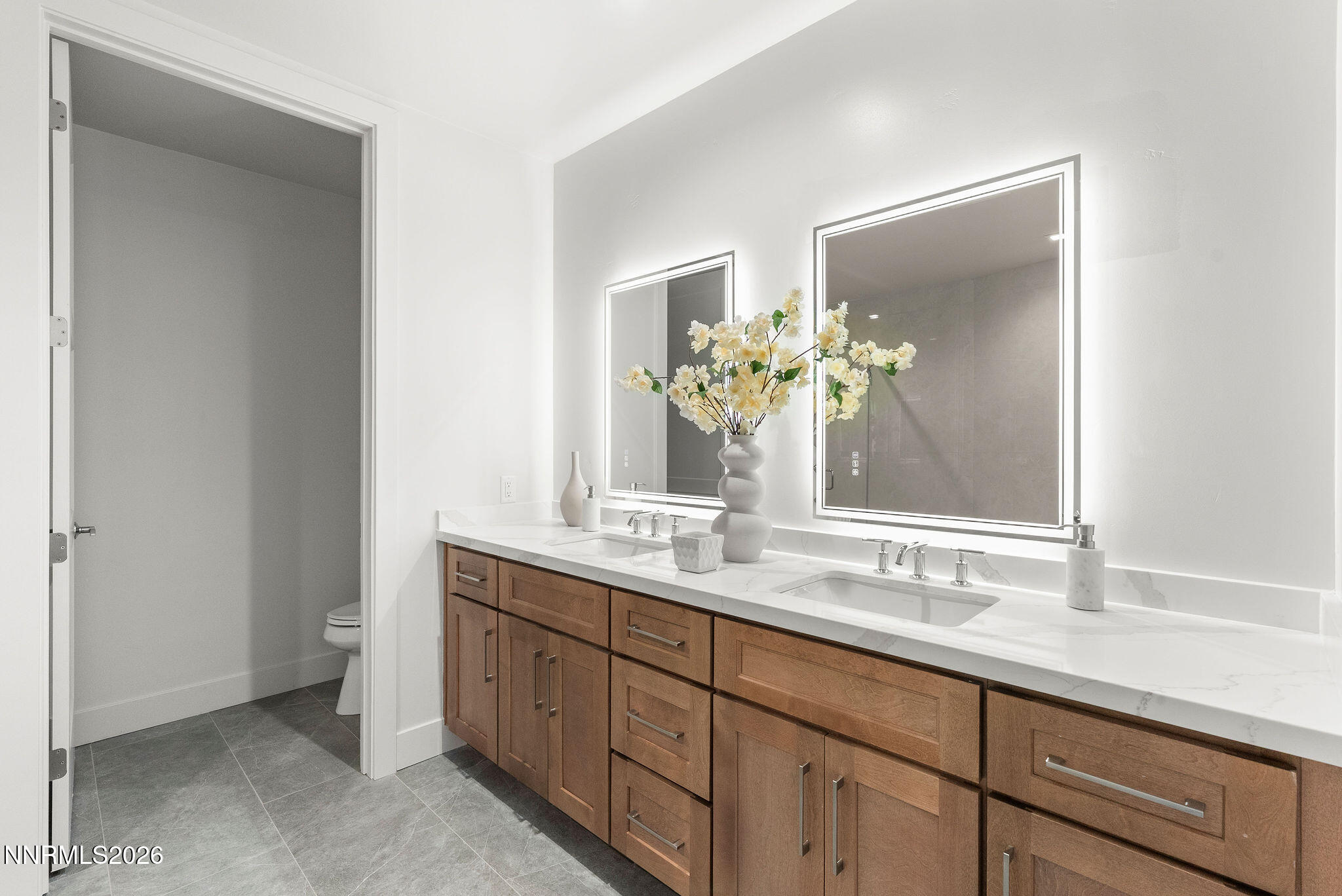 323 Tramway Drive, Unit 107 Stateline, NV 89449 - Photo 13 of 27 a bathroom with a double vanity sink and a mirror