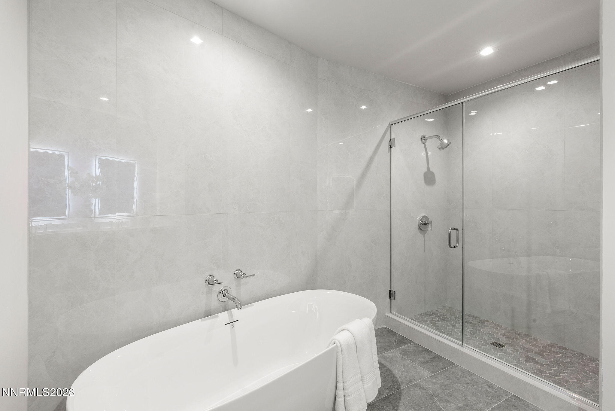 323 Tramway Drive, Unit 107 Stateline, NV 89449 - Photo 15 of 27 a bathroom with a bathtub and shower