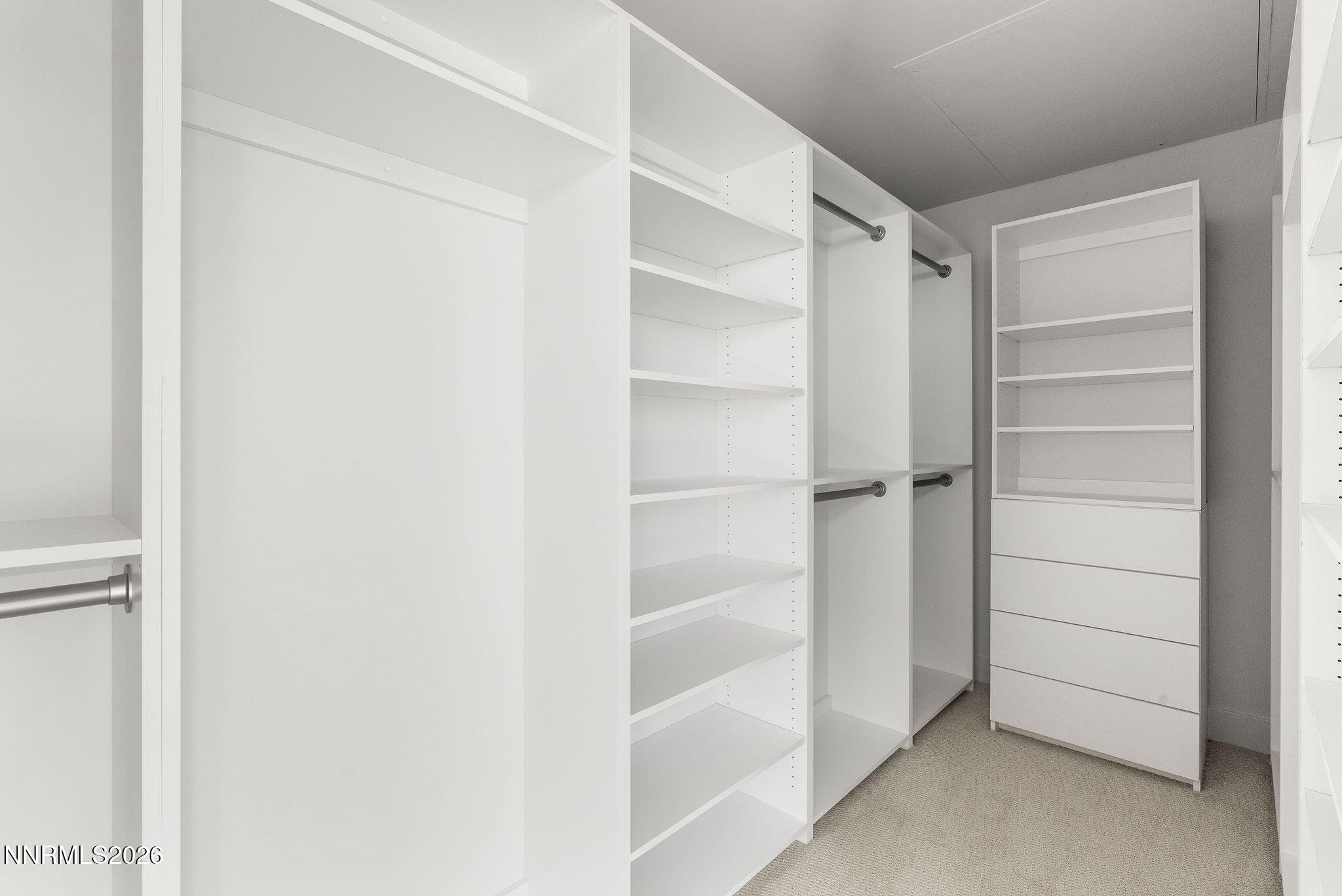 323 Tramway Drive, Unit 107 Stateline, NV 89449 - Photo 16 of 27 a view of walk in closet with empty racks