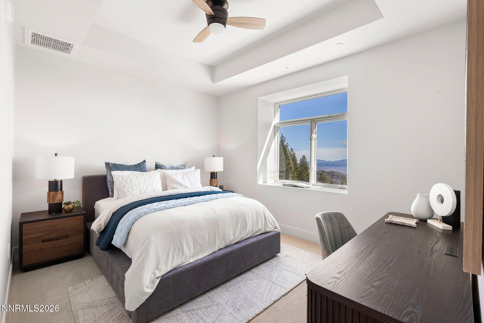 323 Tramway Drive, Unit 107 Stateline, NV 89449 - Photo 17 of 27 a bedroom with a bed and a window