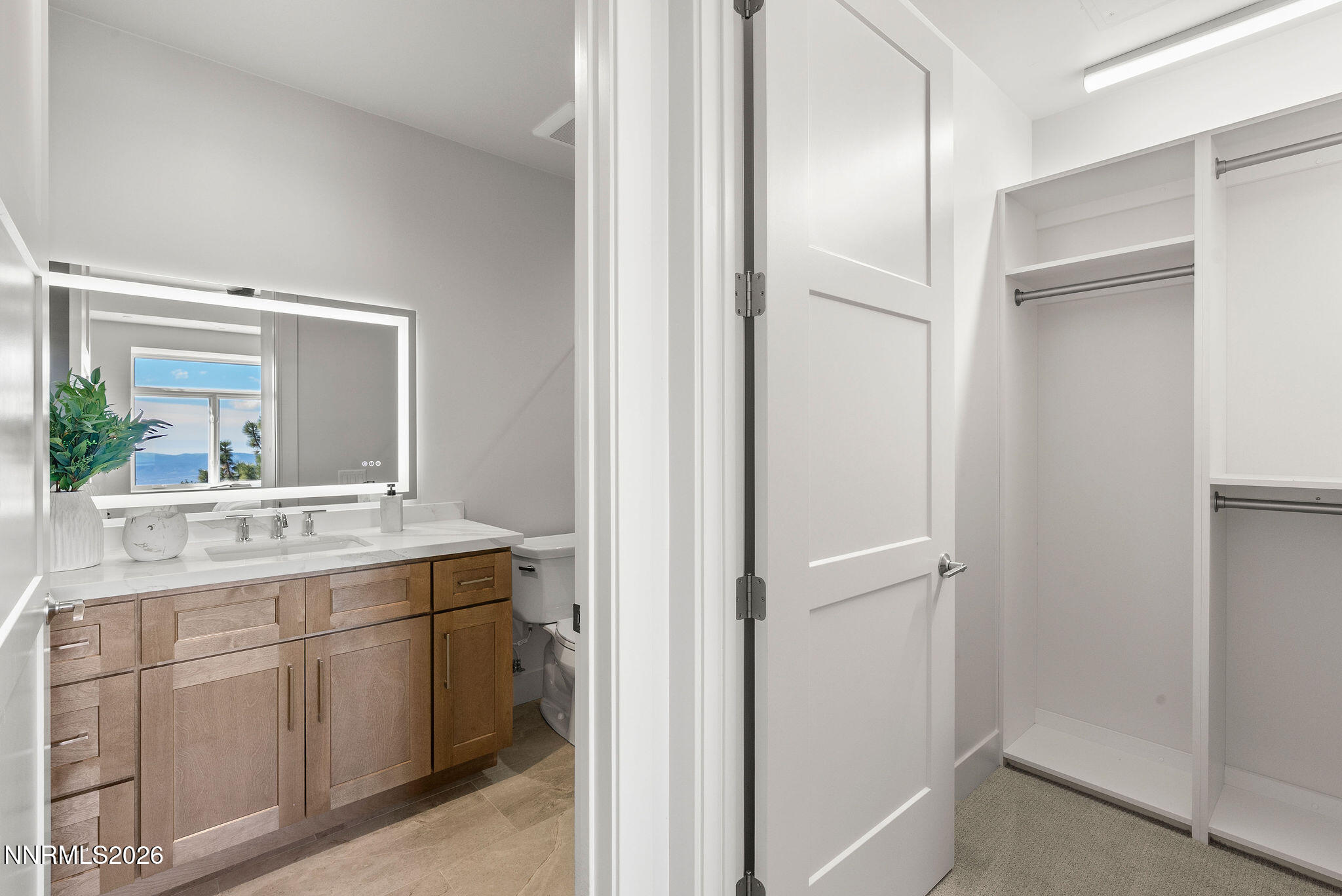 323 Tramway Drive, Unit 107 Stateline, NV 89449 - Photo 18 of 27 a bathroom with a granite countertop sink mirror and a