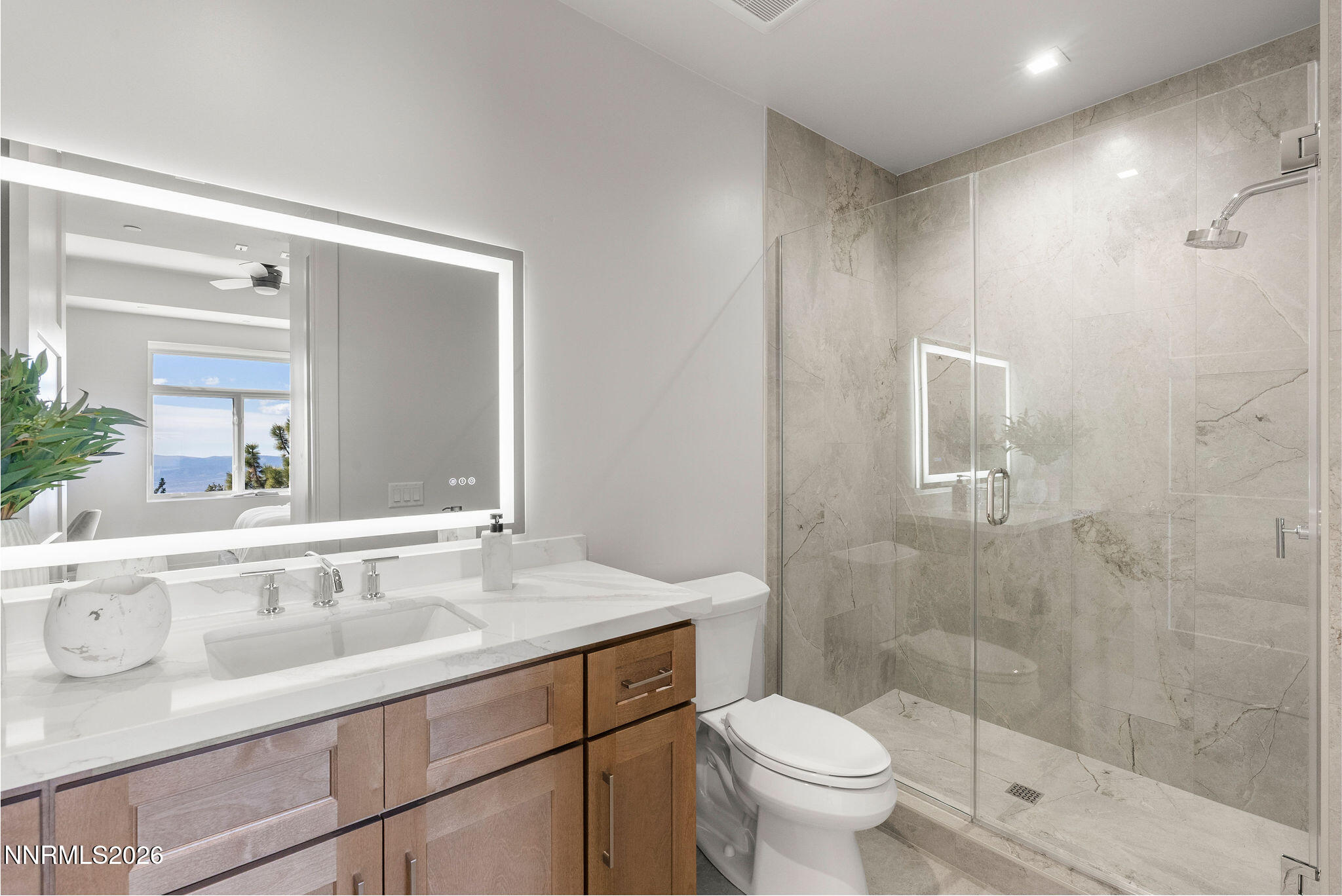 323 Tramway Drive, Unit 107 Stateline, NV 89449 - Photo 19 of 27 a bathroom with a sink a toilet and shower